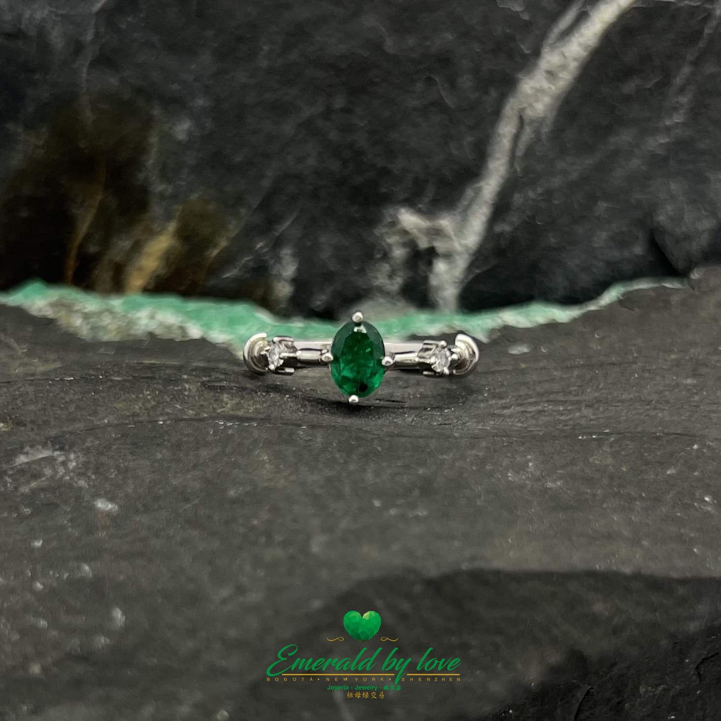 Princess Cut White Gold Ring with Oval Emerald Center and Diamond Accents