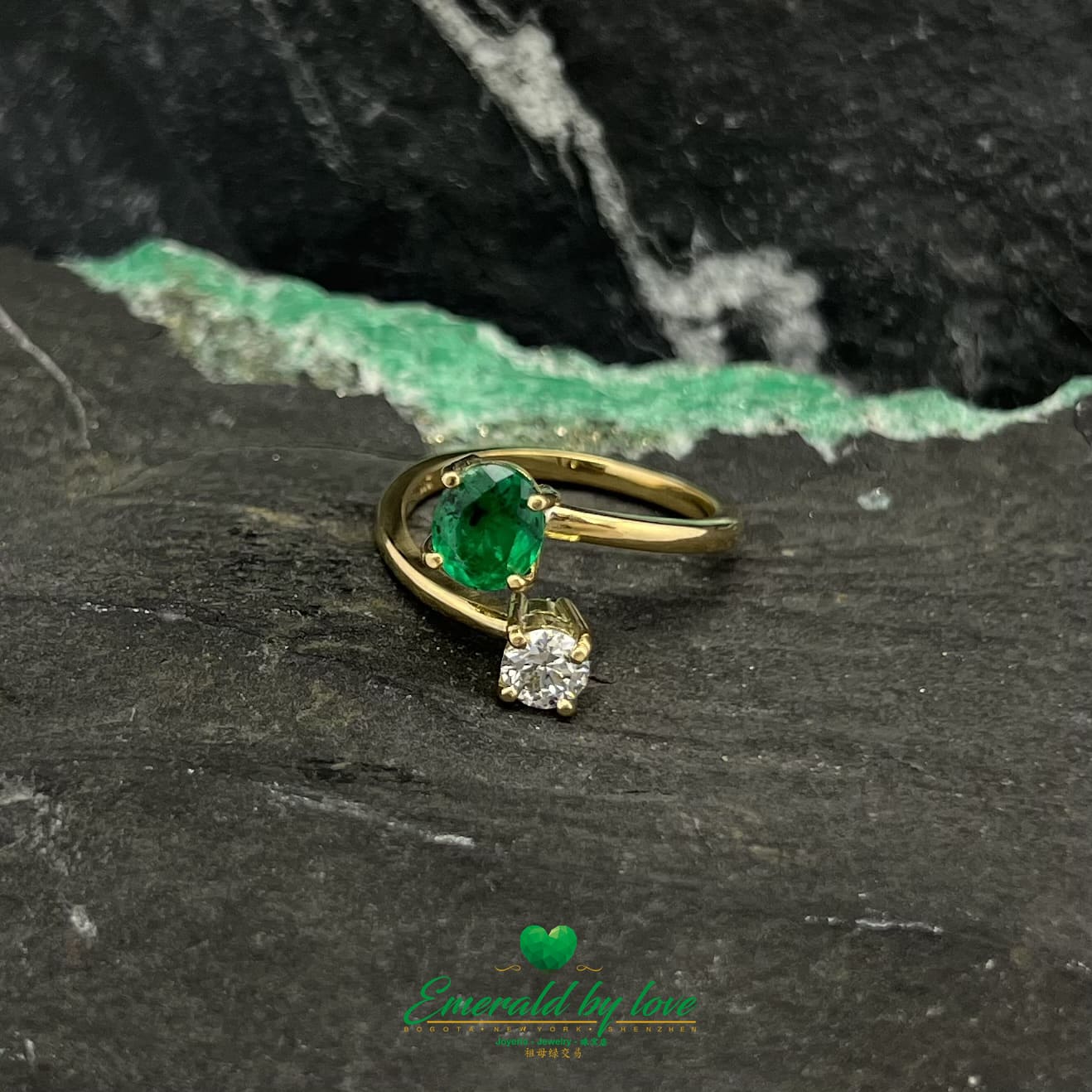 Oval Emerald and Round Diamond Yellow Gold Ring