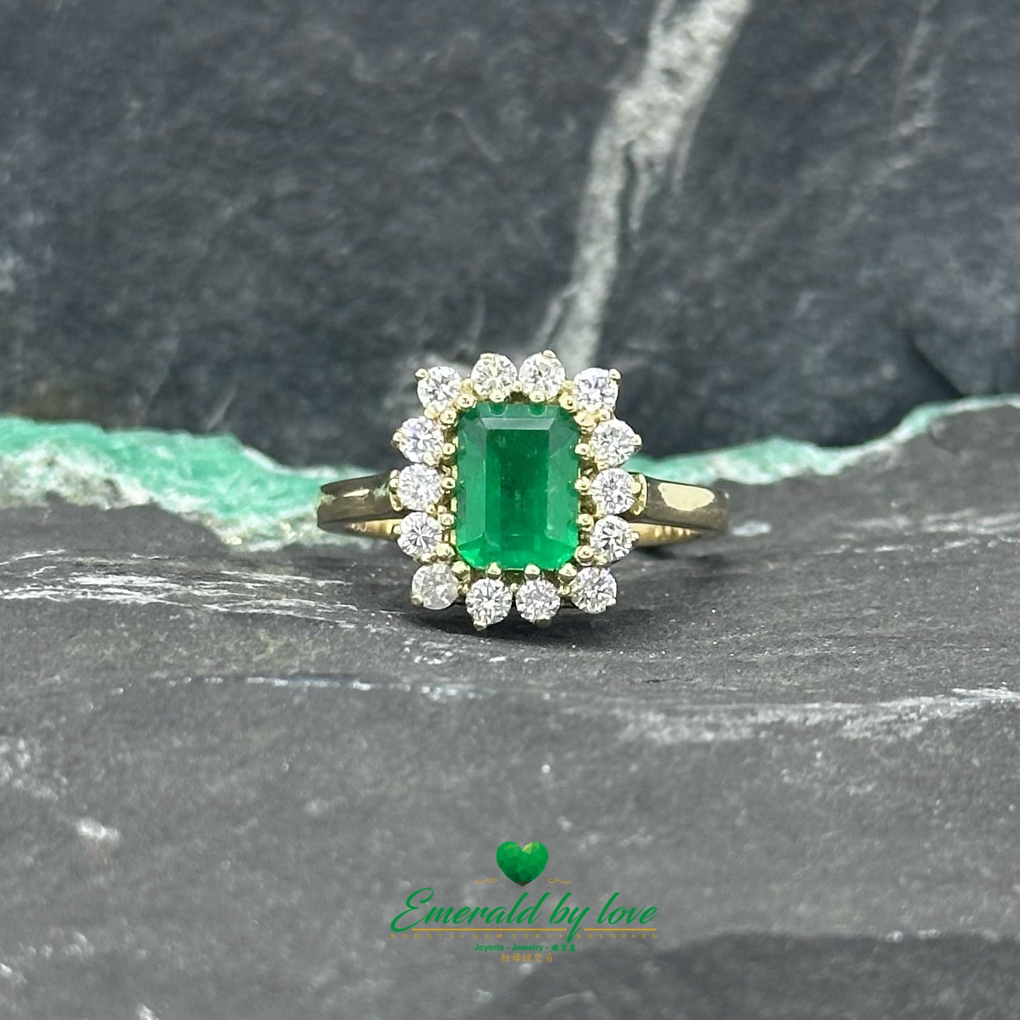 Opulent Luxury Yellow Gold Marquise Ring with Central Colombian Emerald and Diamond Halo