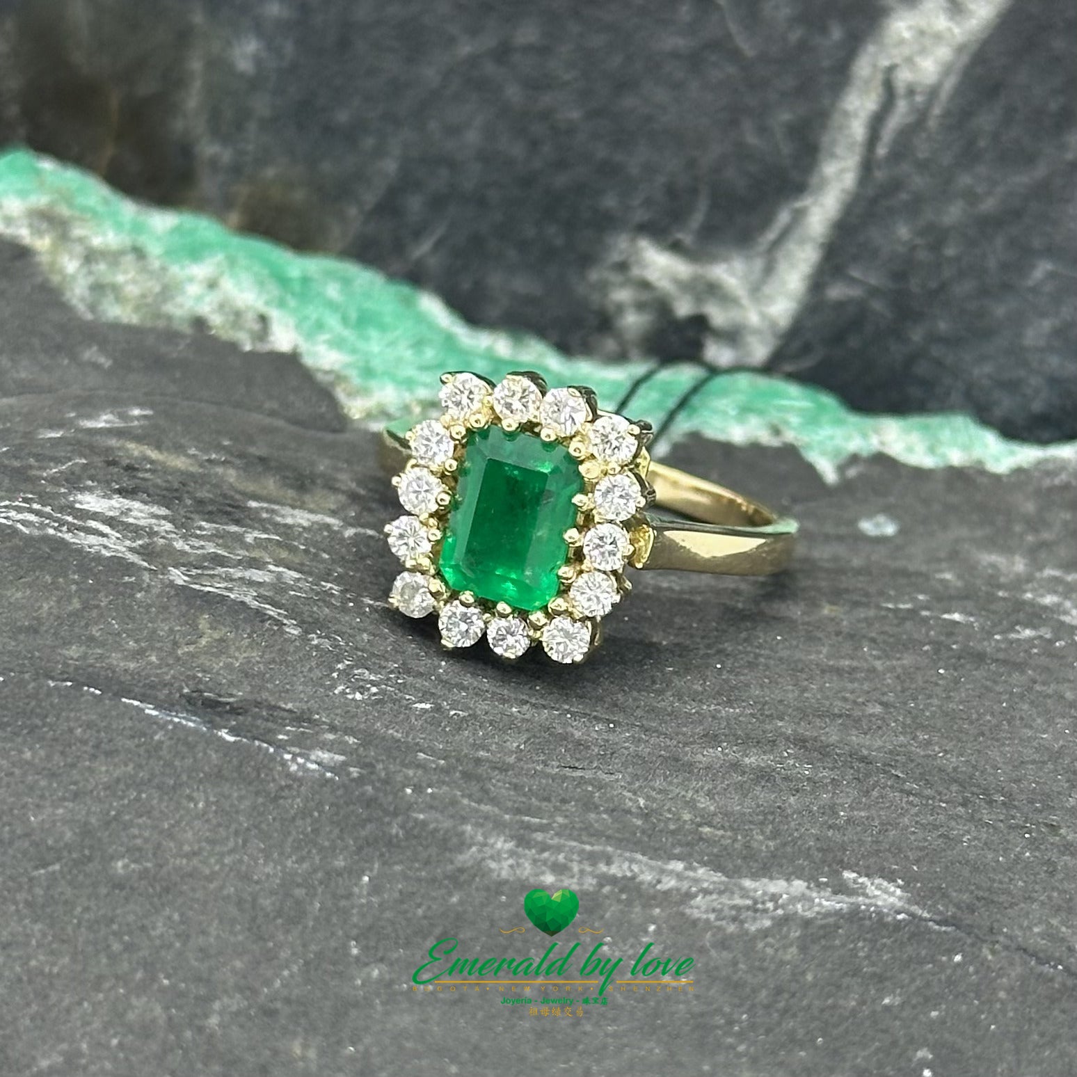 Opulent Luxury Yellow Gold Marquise Ring with Central Colombian Emerald and Diamond Halo