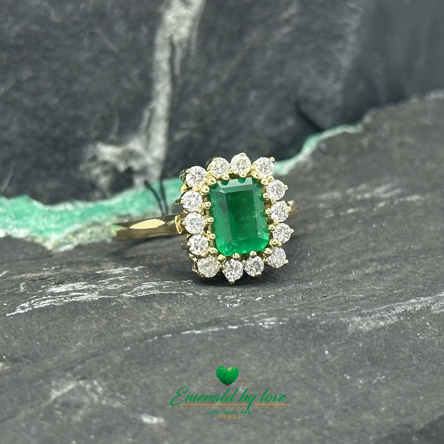 Opulent Luxury Yellow Gold Marquise Ring with Central Colombian Emerald and Diamond Halo