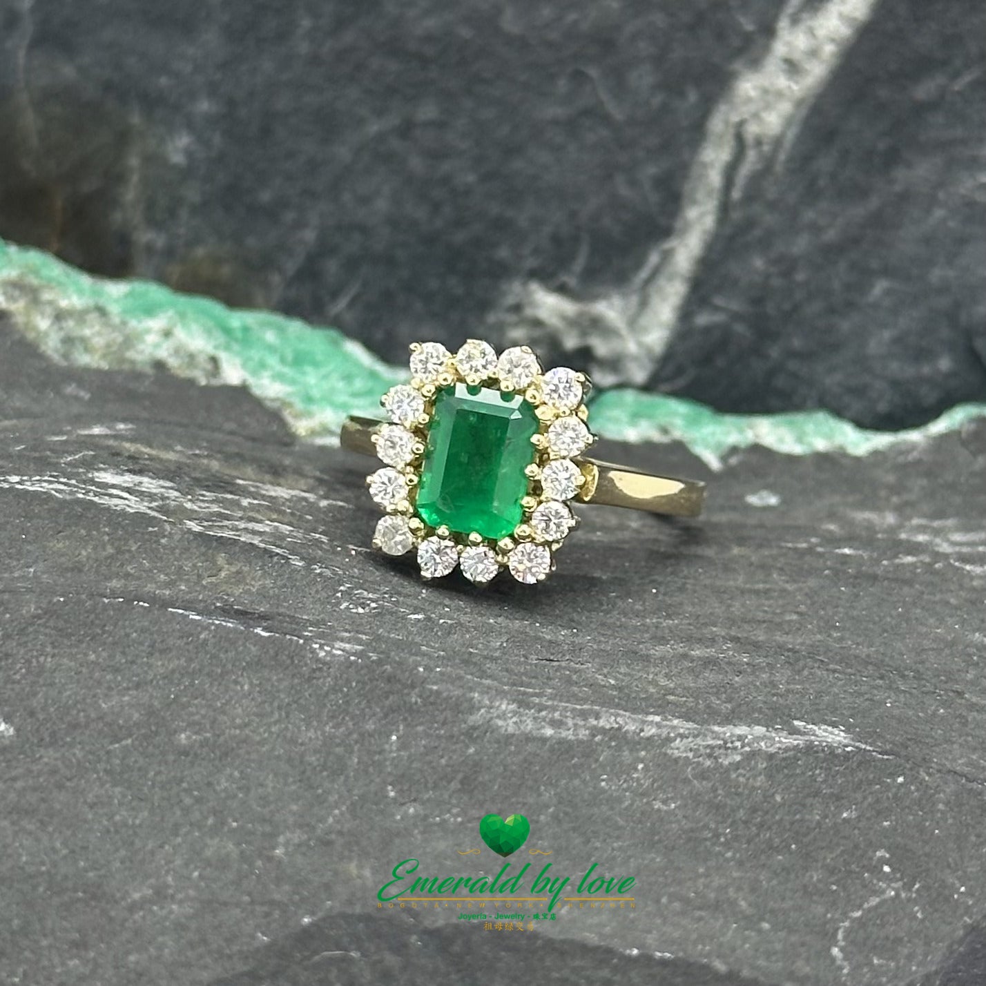 Opulent Luxury Yellow Gold Marquise Ring with Central Colombian Emerald and Diamond Halo