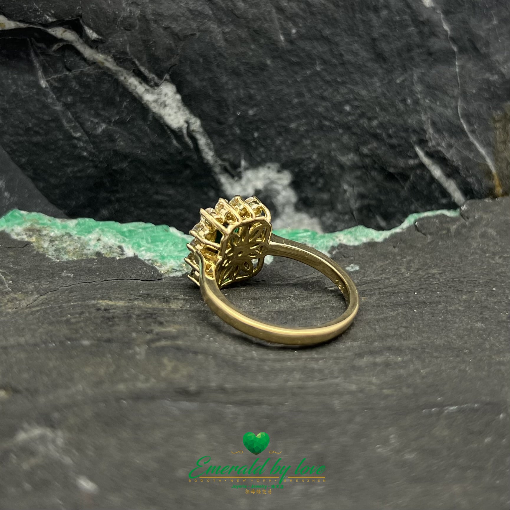 Opulent Luxury Yellow Gold Marquise Ring with Central Colombian Emerald and Diamond Halo