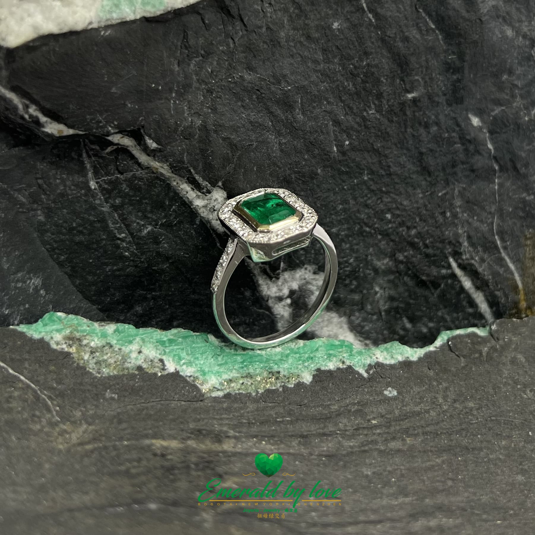 Rectangular Emerald Bezel Set Ring with Diamond Halo in White Gold