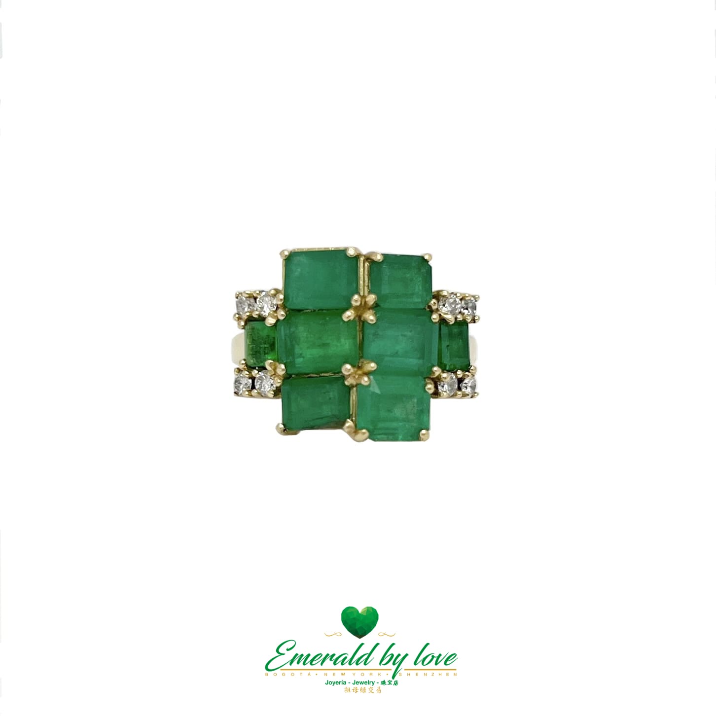 Yellow Gold Ring Adorned with Rectangular Emeralds and Diamonds