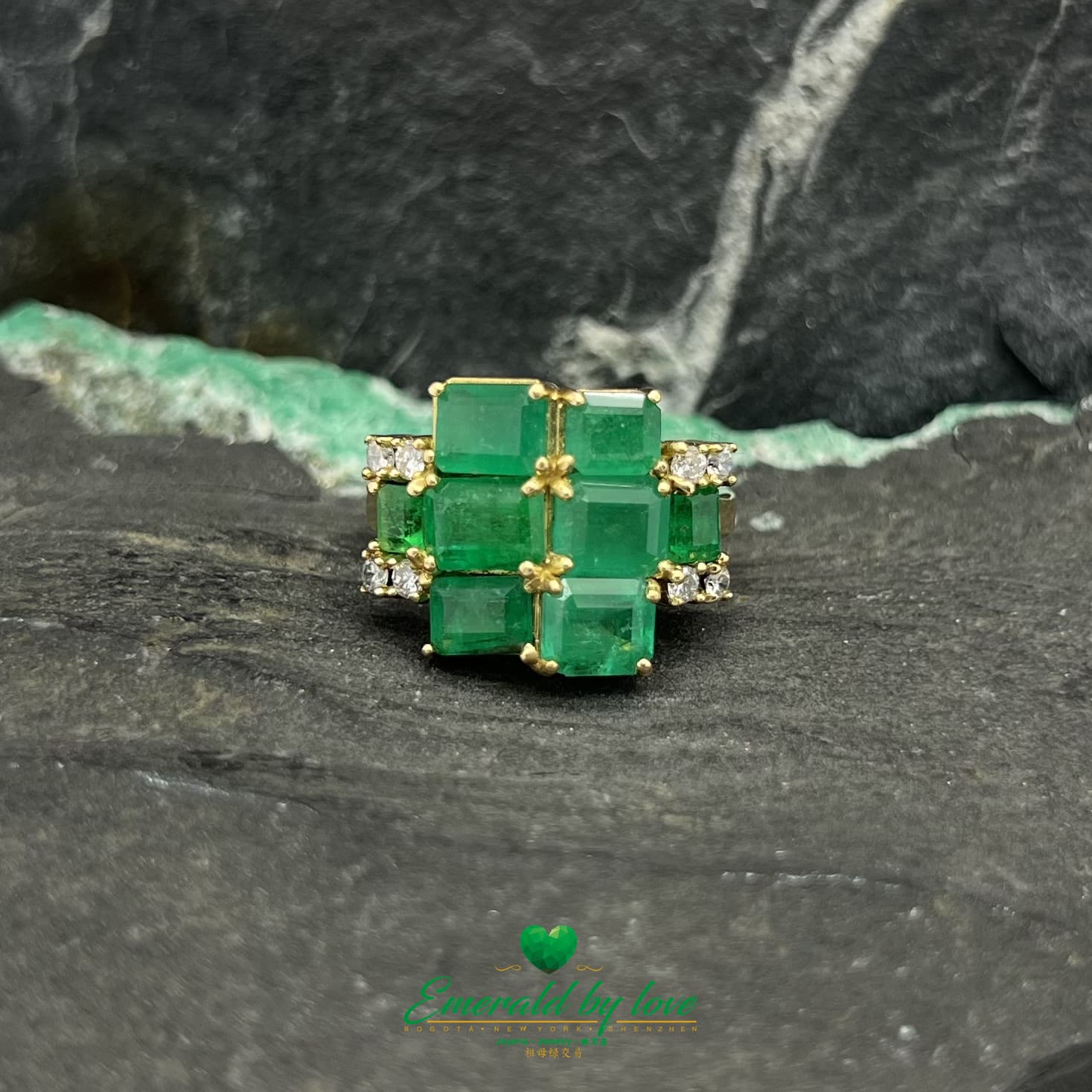 Yellow Gold Ring Adorned with Rectangular Emeralds and Diamonds