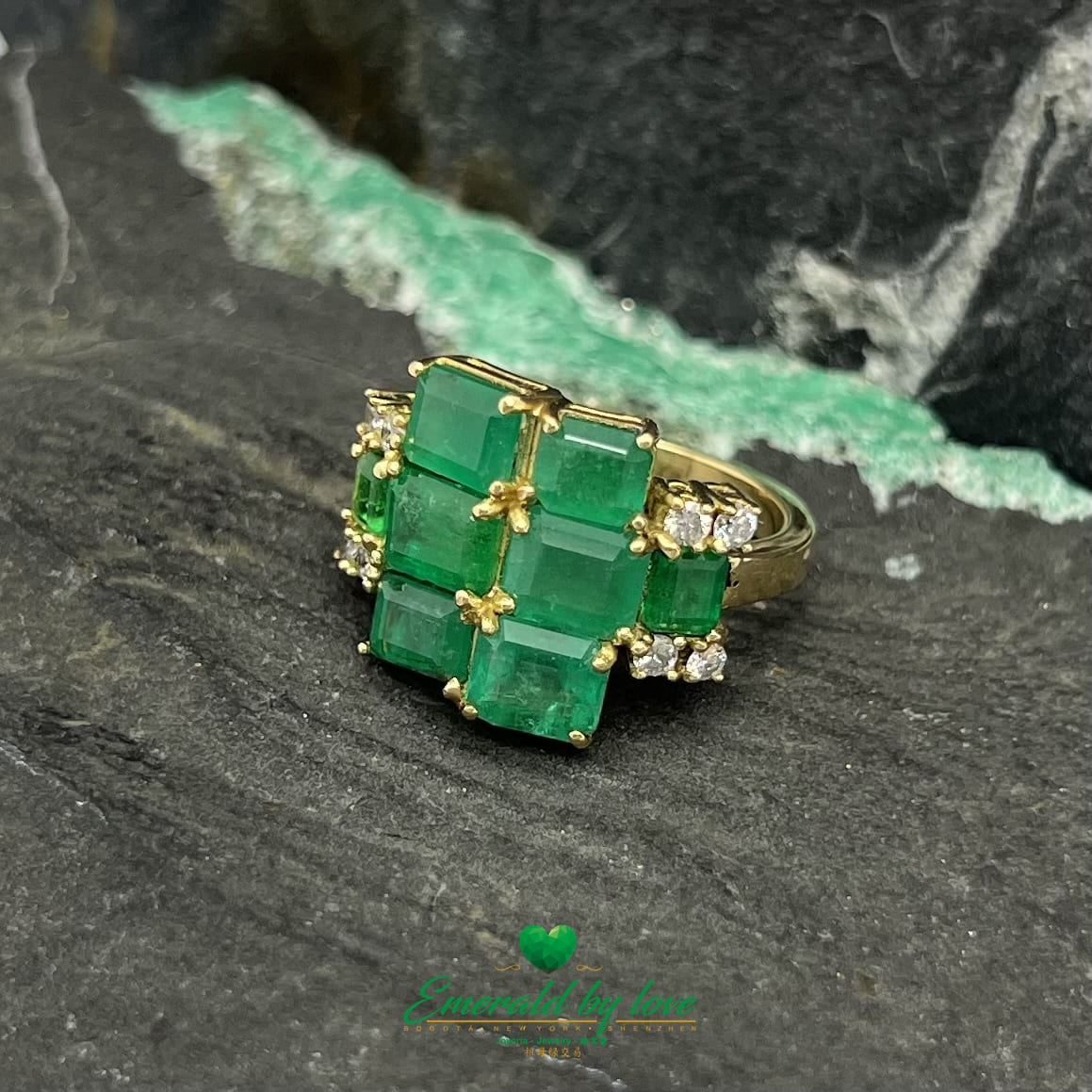 Yellow Gold Ring Adorned with Rectangular Emeralds and Diamonds