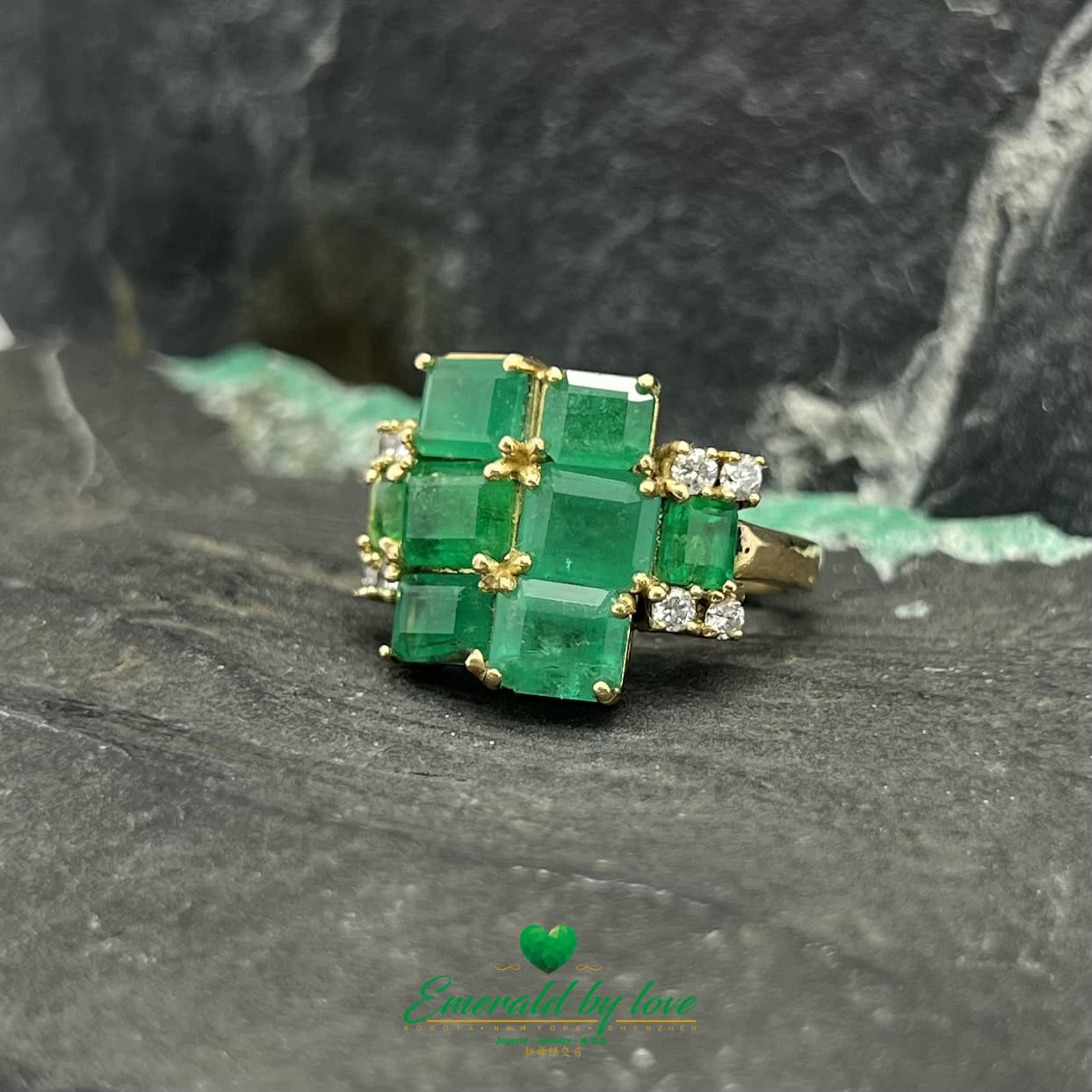 Yellow Gold Ring Adorned with Rectangular Emeralds and Diamonds