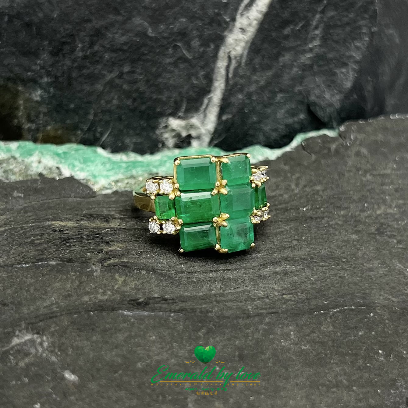 Yellow Gold Ring Adorned with Rectangular Emeralds and Diamonds