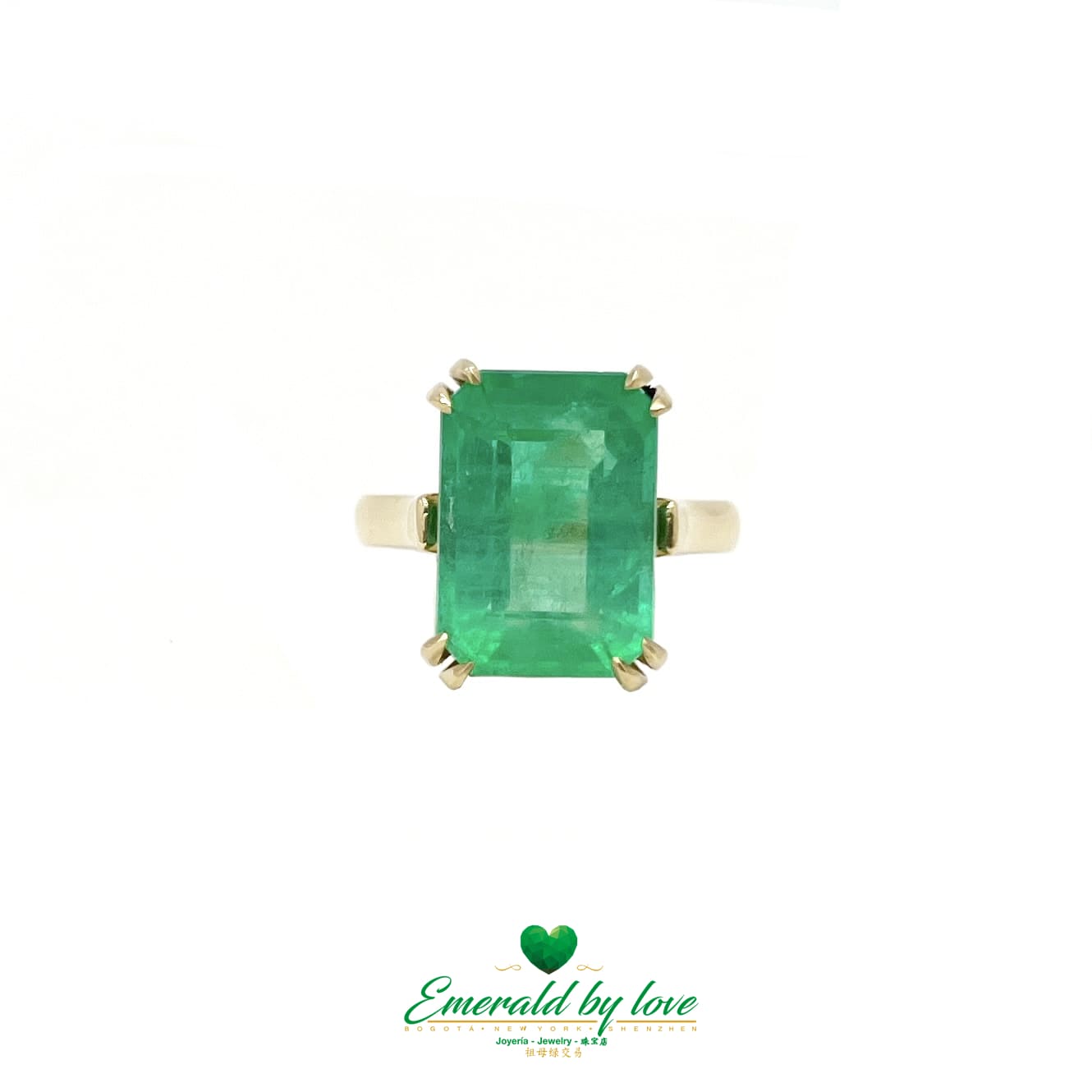 Magnificent Majesty: Yellow Gold Ring with Spectacular Emerald-Cut Emerald Centerpiece