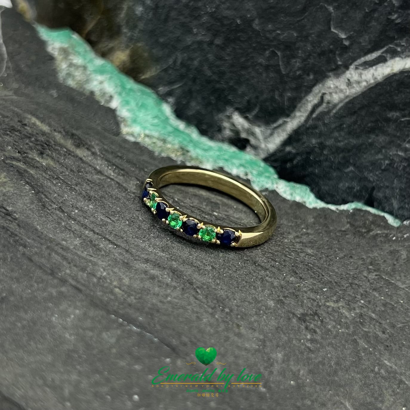 Ethereal Harmony: Yellow Gold Band Ring with Emeralds and Sapphires