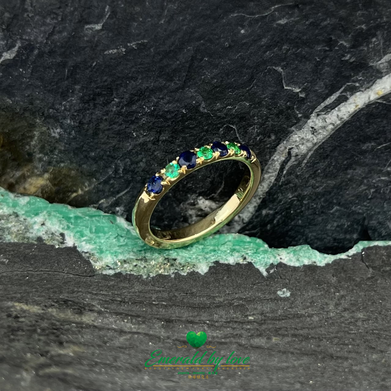 Ethereal Harmony: Yellow Gold Band Ring with Emeralds and Sapphires
