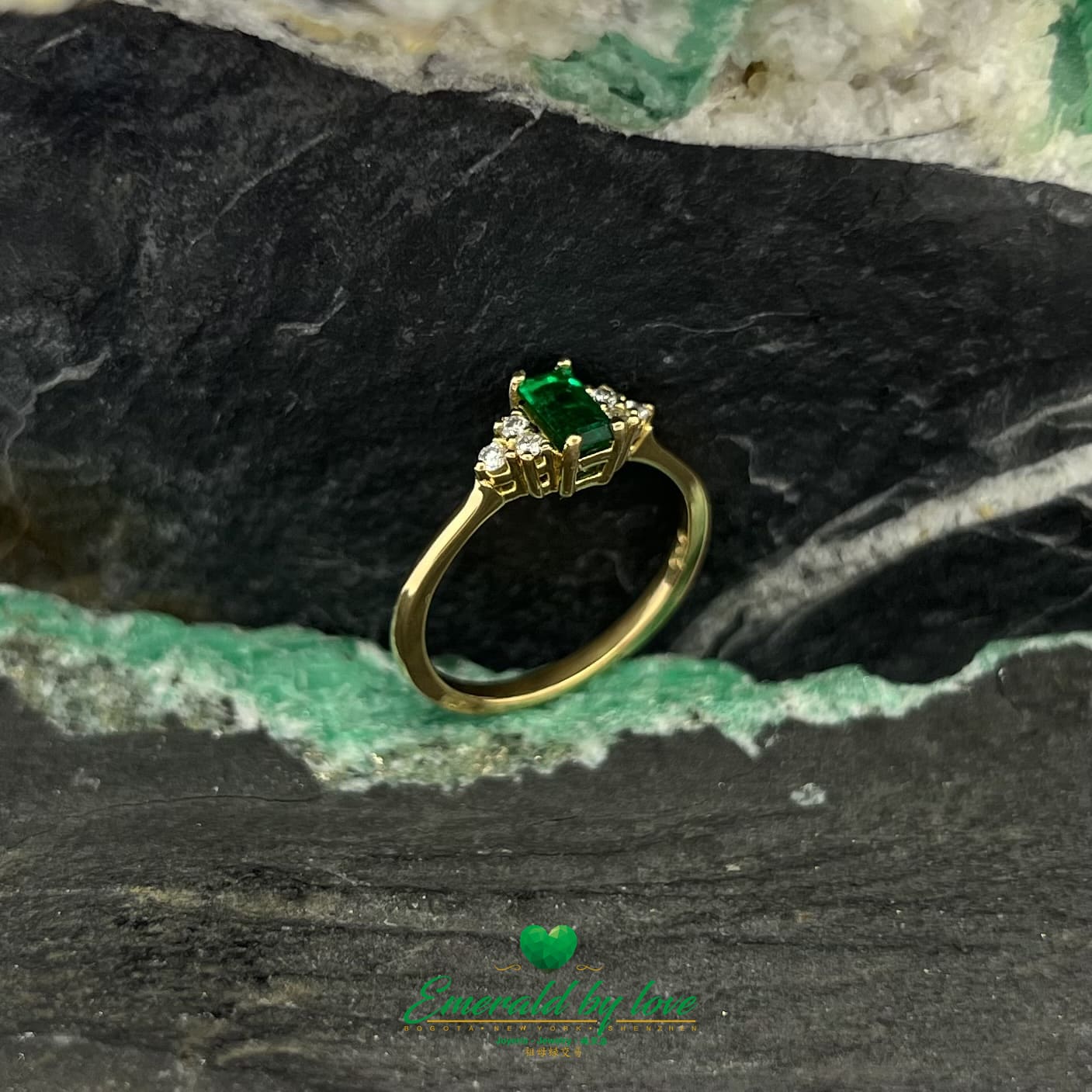 Yellow Gold Ring with Dark Green Baguette Emerald and Three Diamonds on Each Side
