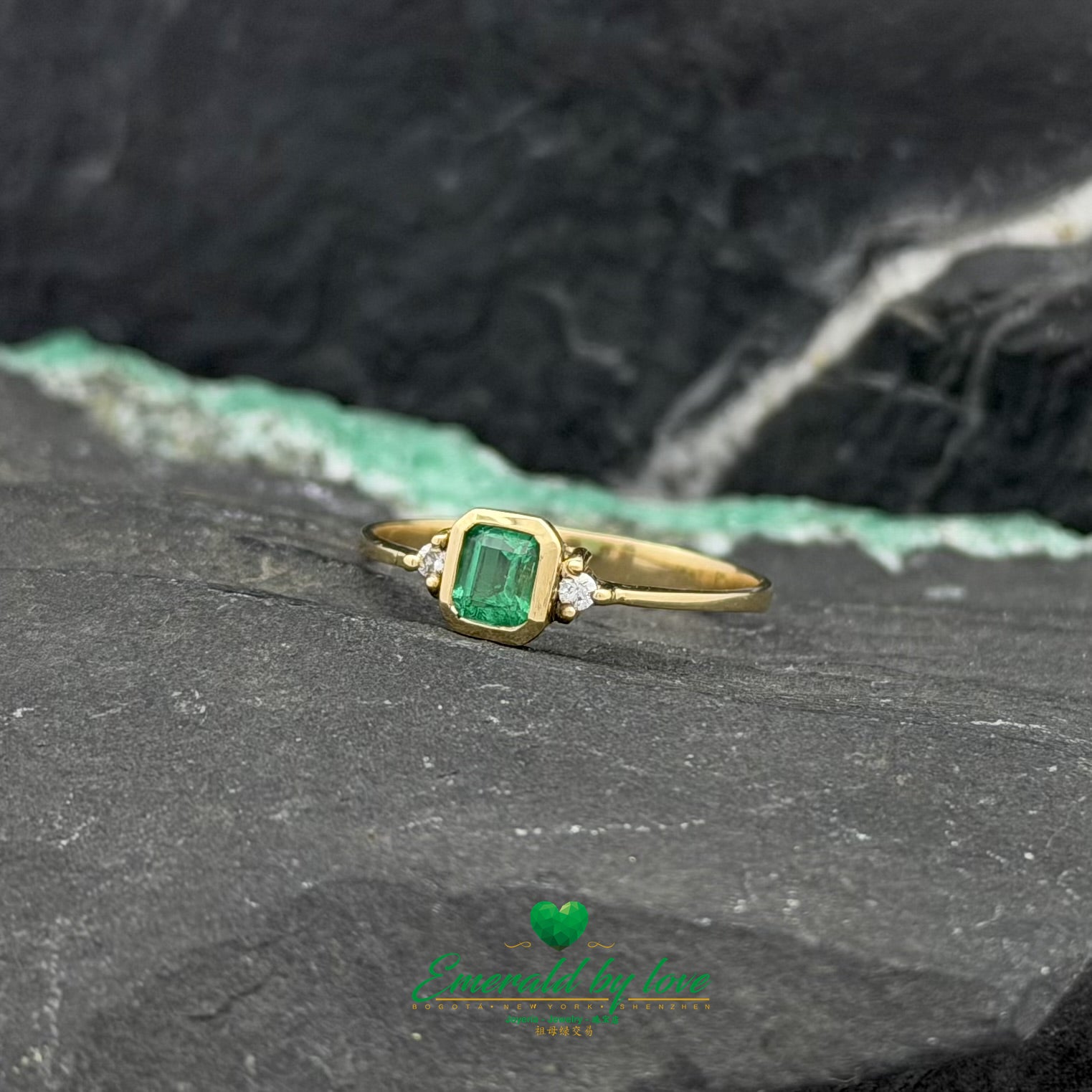 Yellow Gold Ring with Bezel-Set Emerald and Side Diamonds