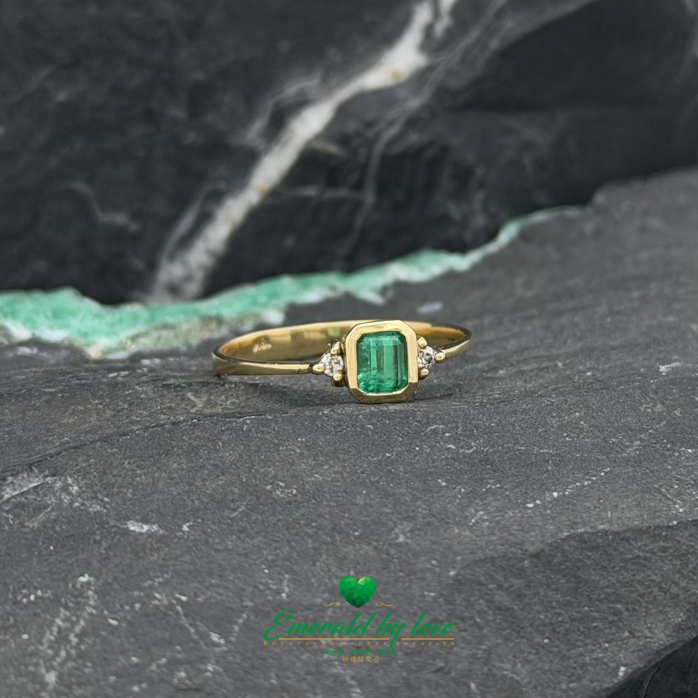 Yellow Gold Ring with Bezel-Set Emerald and Side Diamonds
