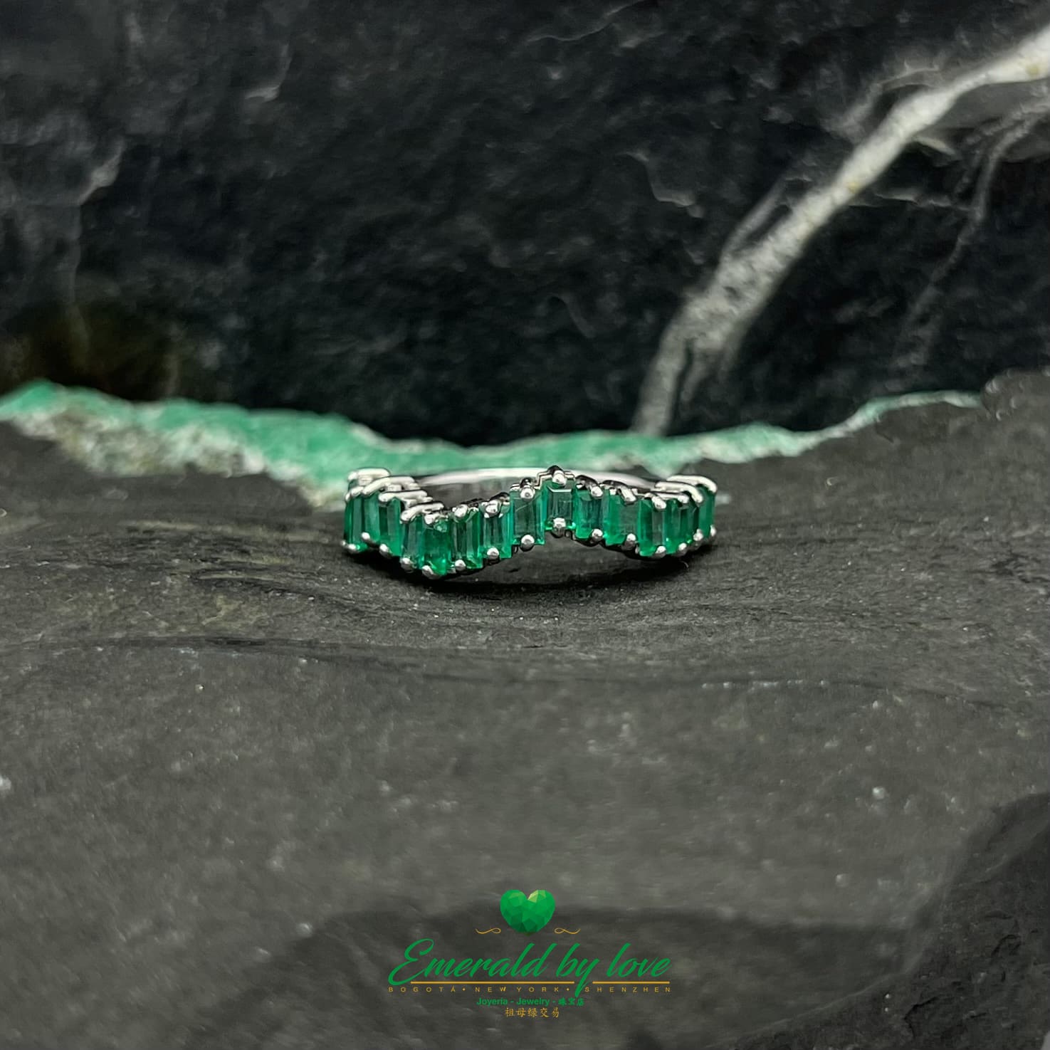 Yellow, Rose and White Gold Ring with Baguette Emeralds Encircling the Band