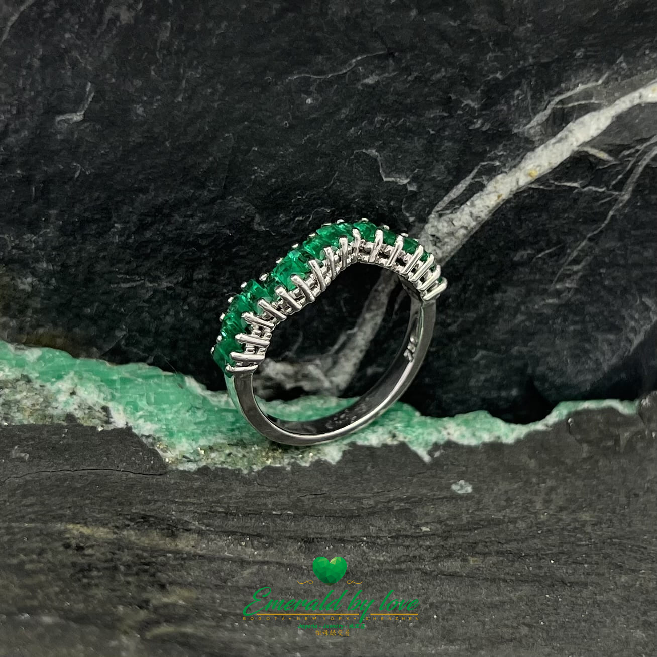 Yellow, Rose and White Gold Ring with Baguette Emeralds Encircling the Band