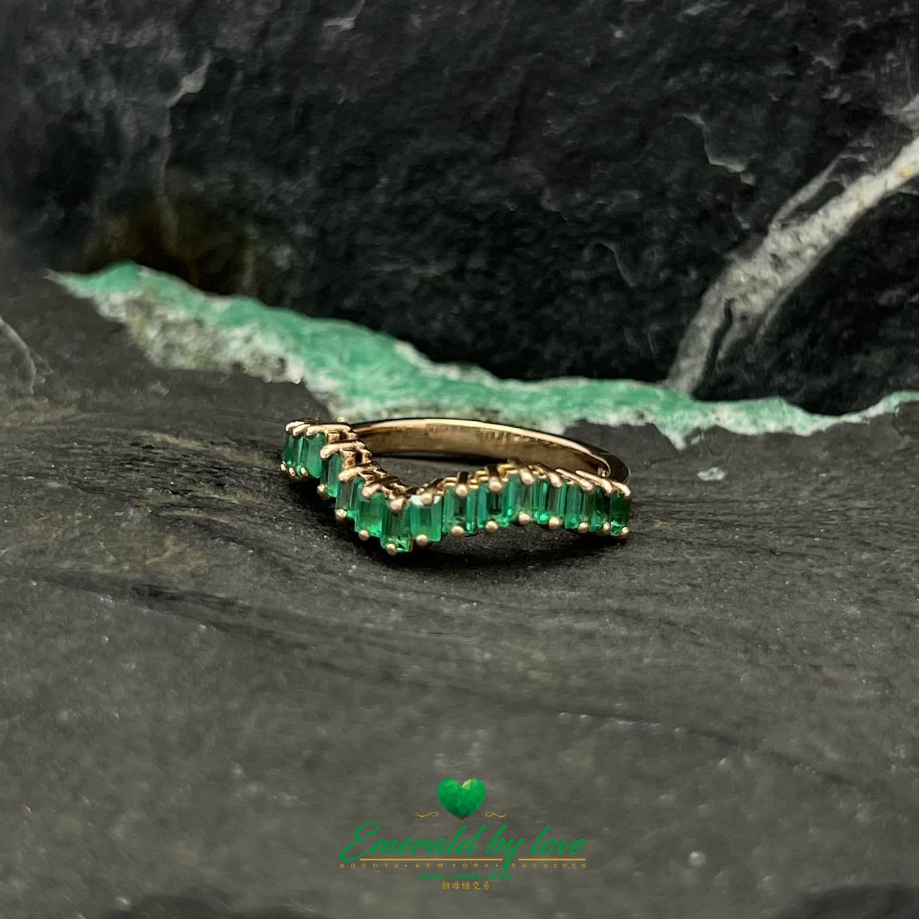 Yellow, Rose and White Gold Ring with Baguette Emeralds Encircling the Band