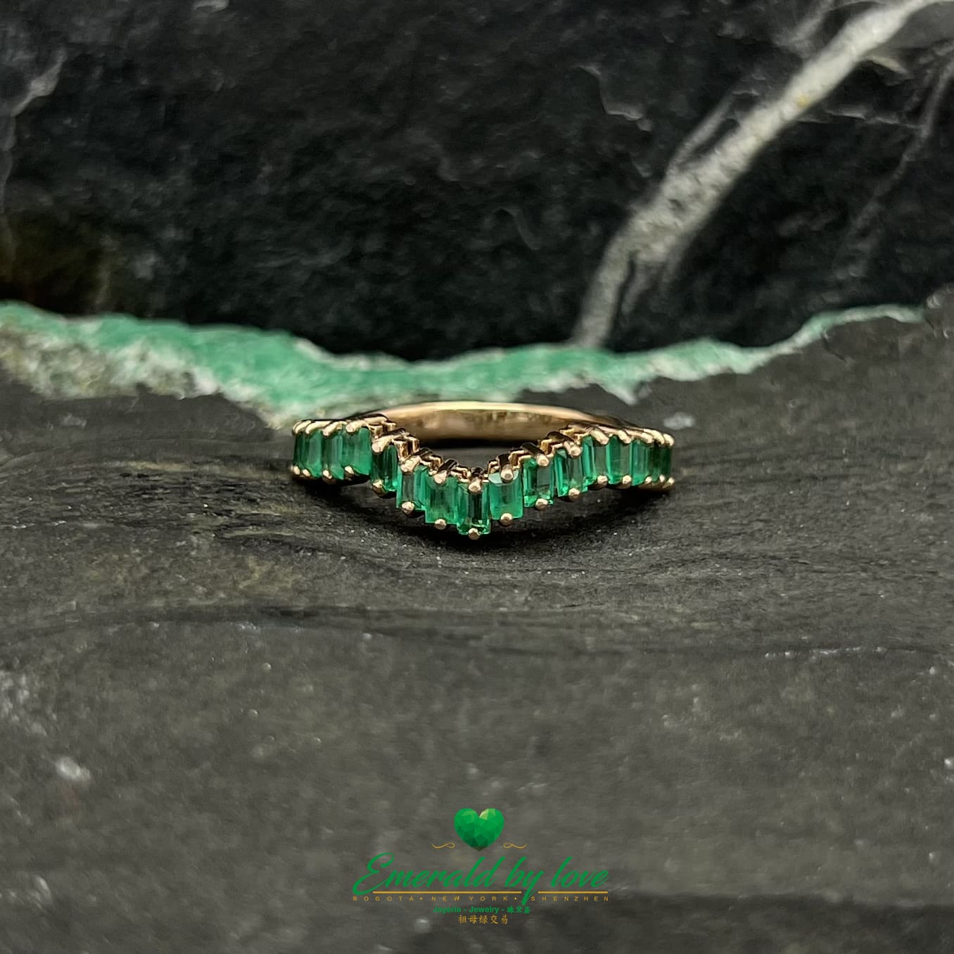 Yellow, Rose and White Gold Ring with Baguette Emeralds Encircling the Band