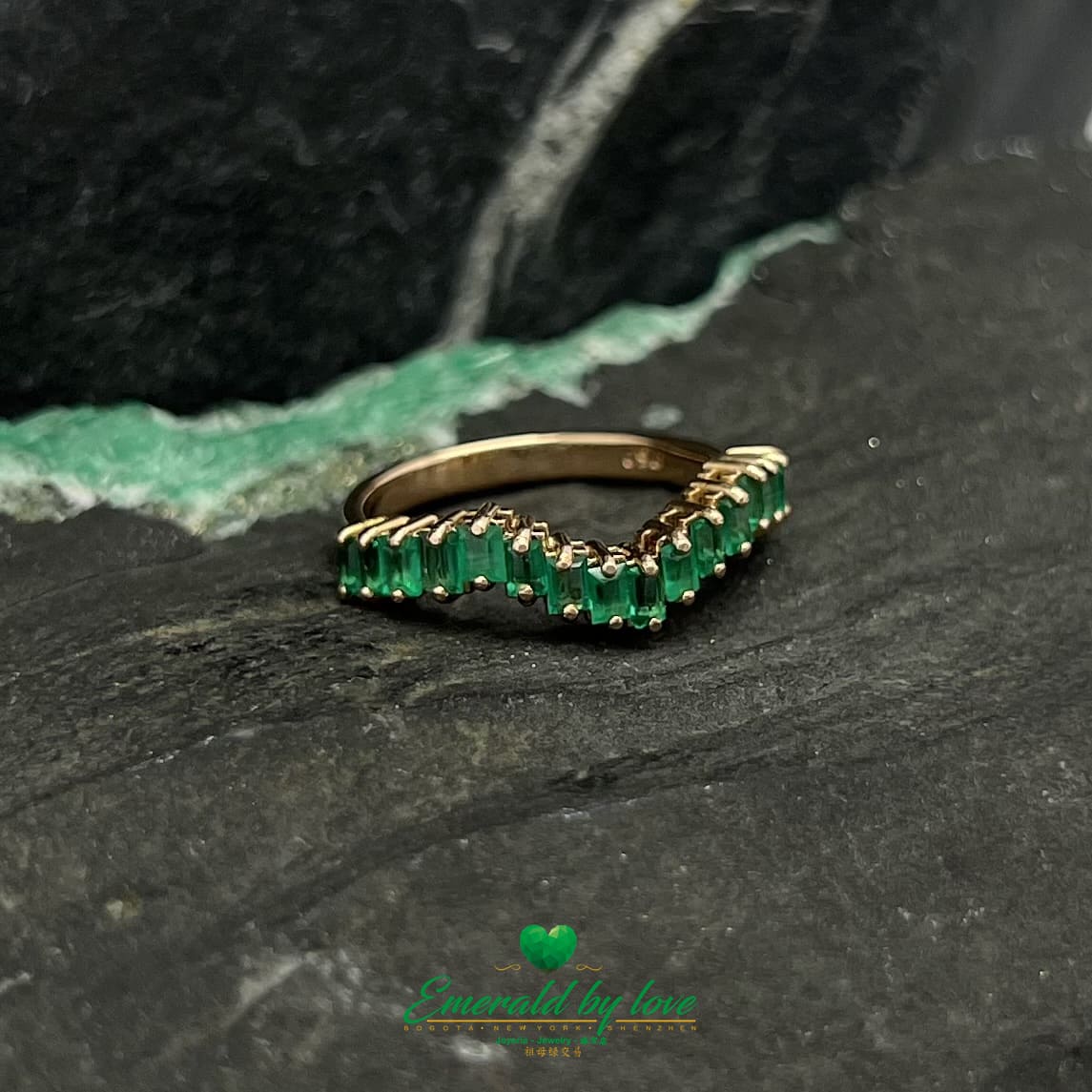 Yellow, Rose and White Gold Ring with Baguette Emeralds Encircling the Band