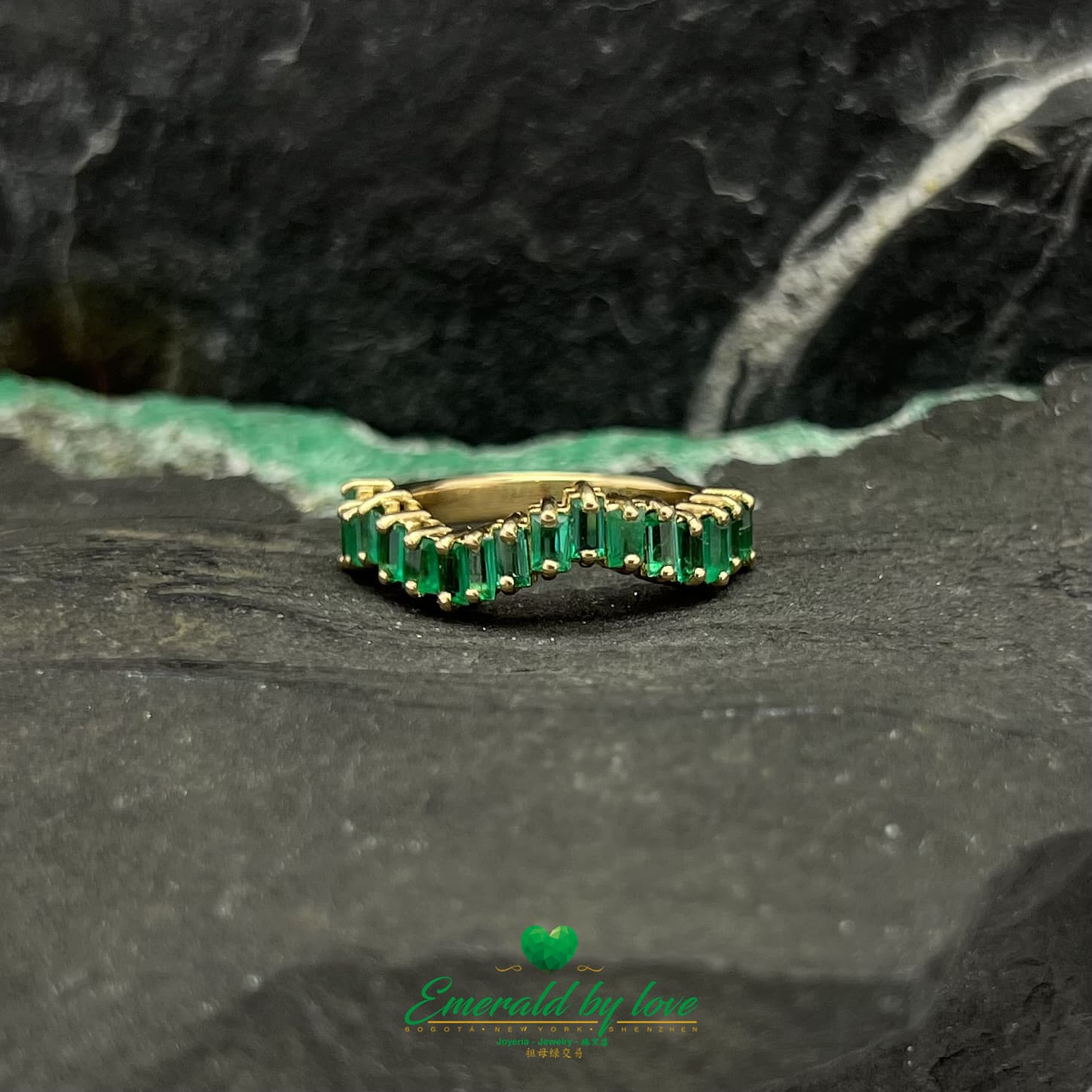 Yellow, Rose and White Gold Ring with Baguette Emeralds Encircling the Band