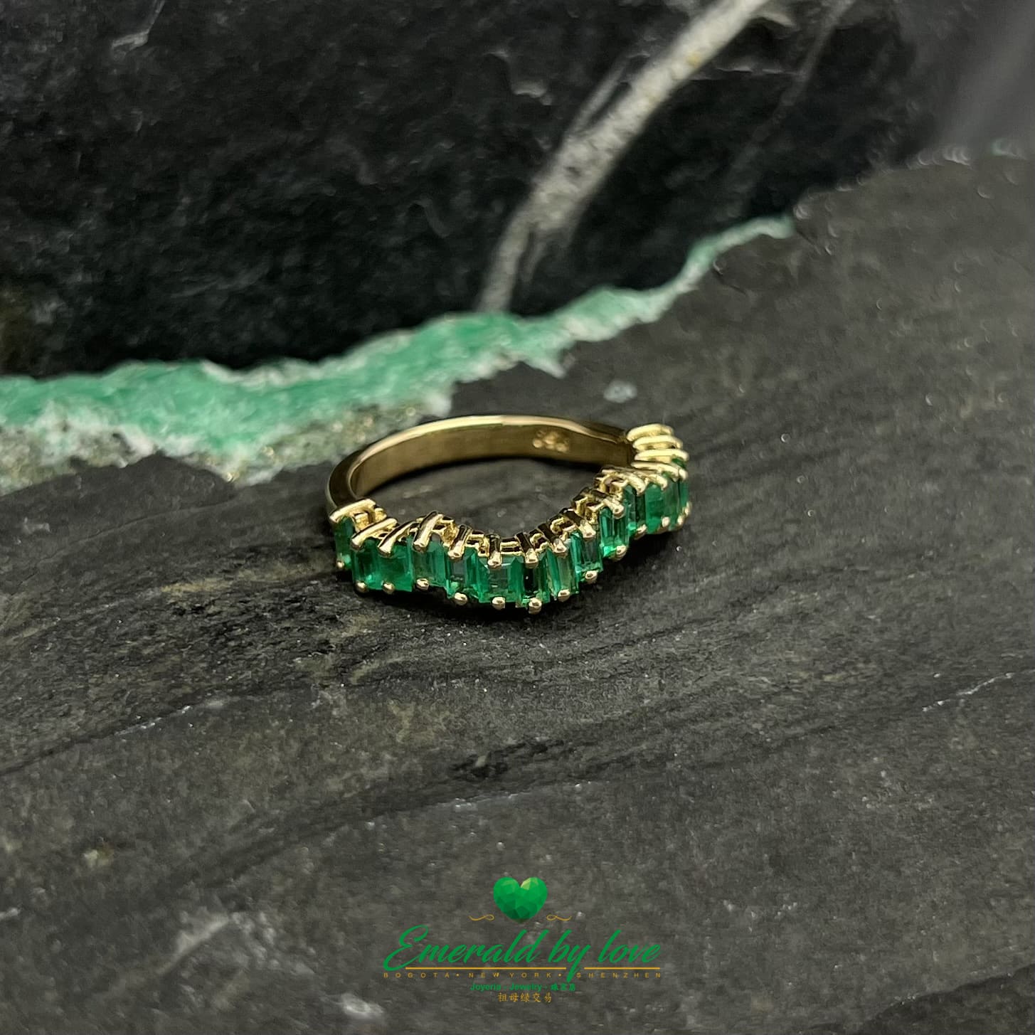 Yellow, Rose and White Gold Ring with Baguette Emeralds Encircling the Band