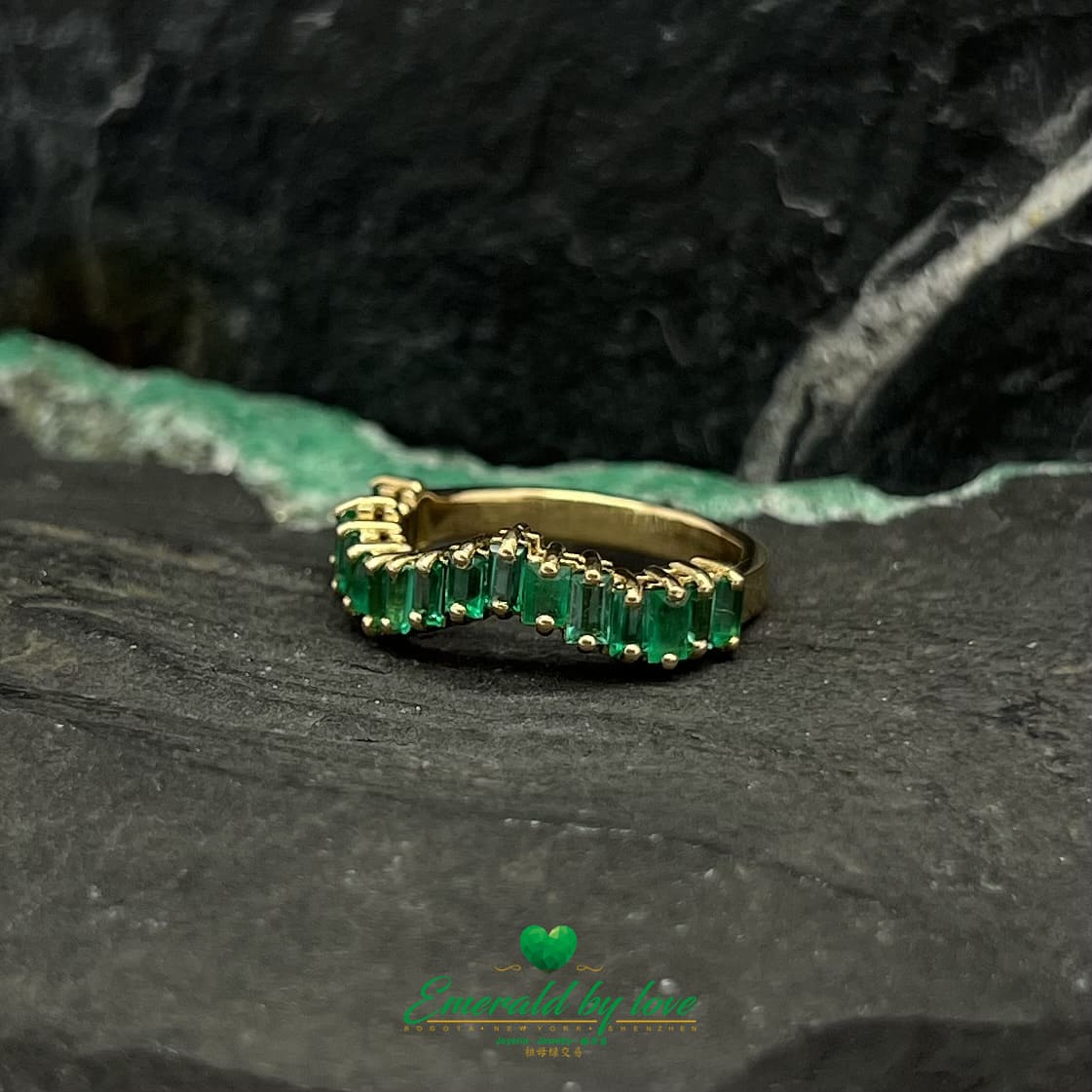 Yellow, Rose and White Gold Ring with Baguette Emeralds Encircling the Band