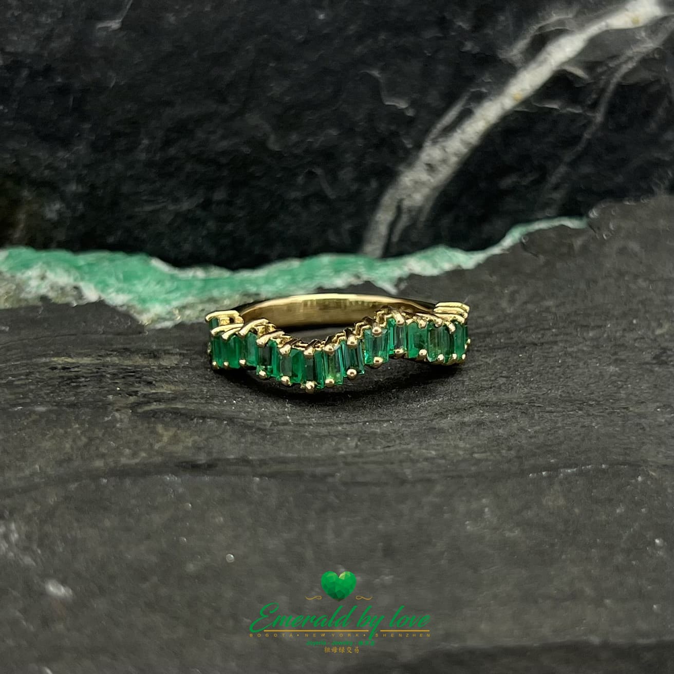 Yellow, Rose and White Gold Ring with Baguette Emeralds Encircling the Band