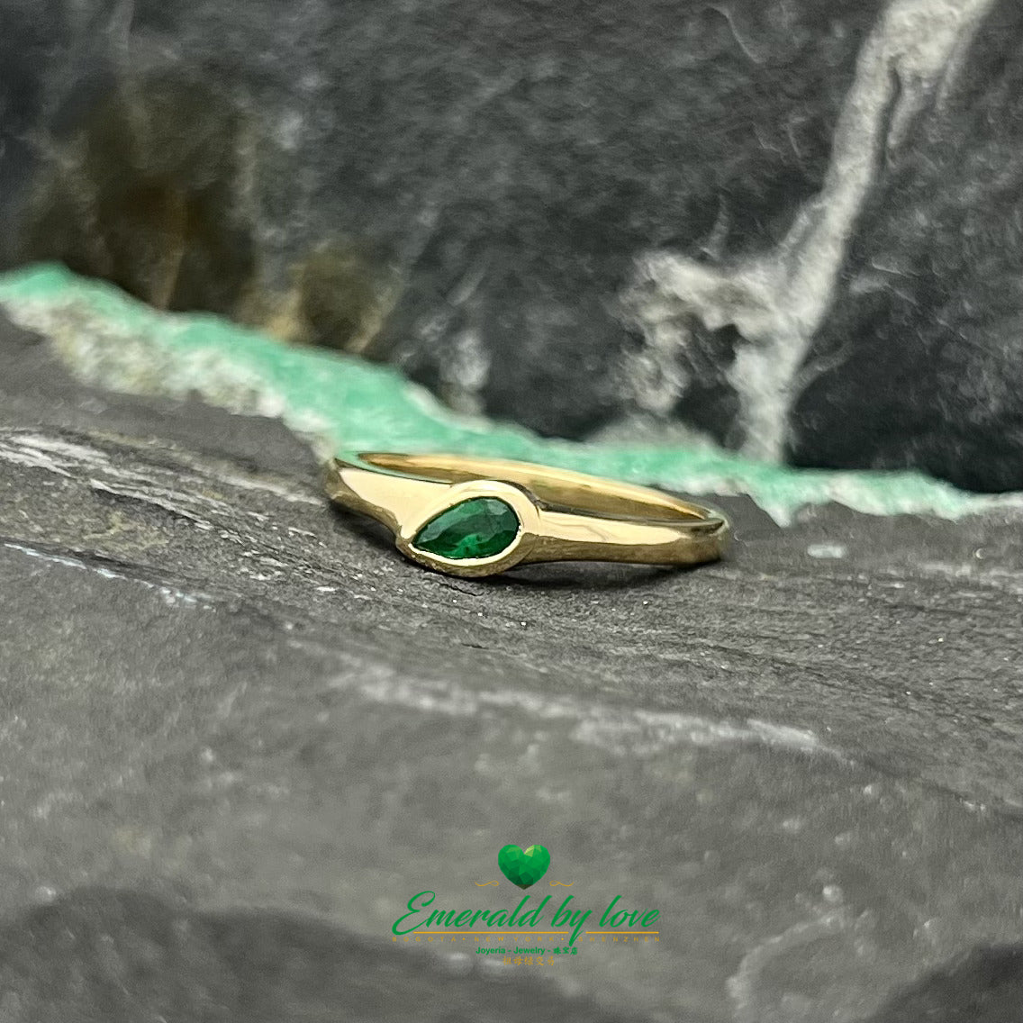 Minimalist Elegance: Sideways Pear-Shaped Emerald Bezel Ring