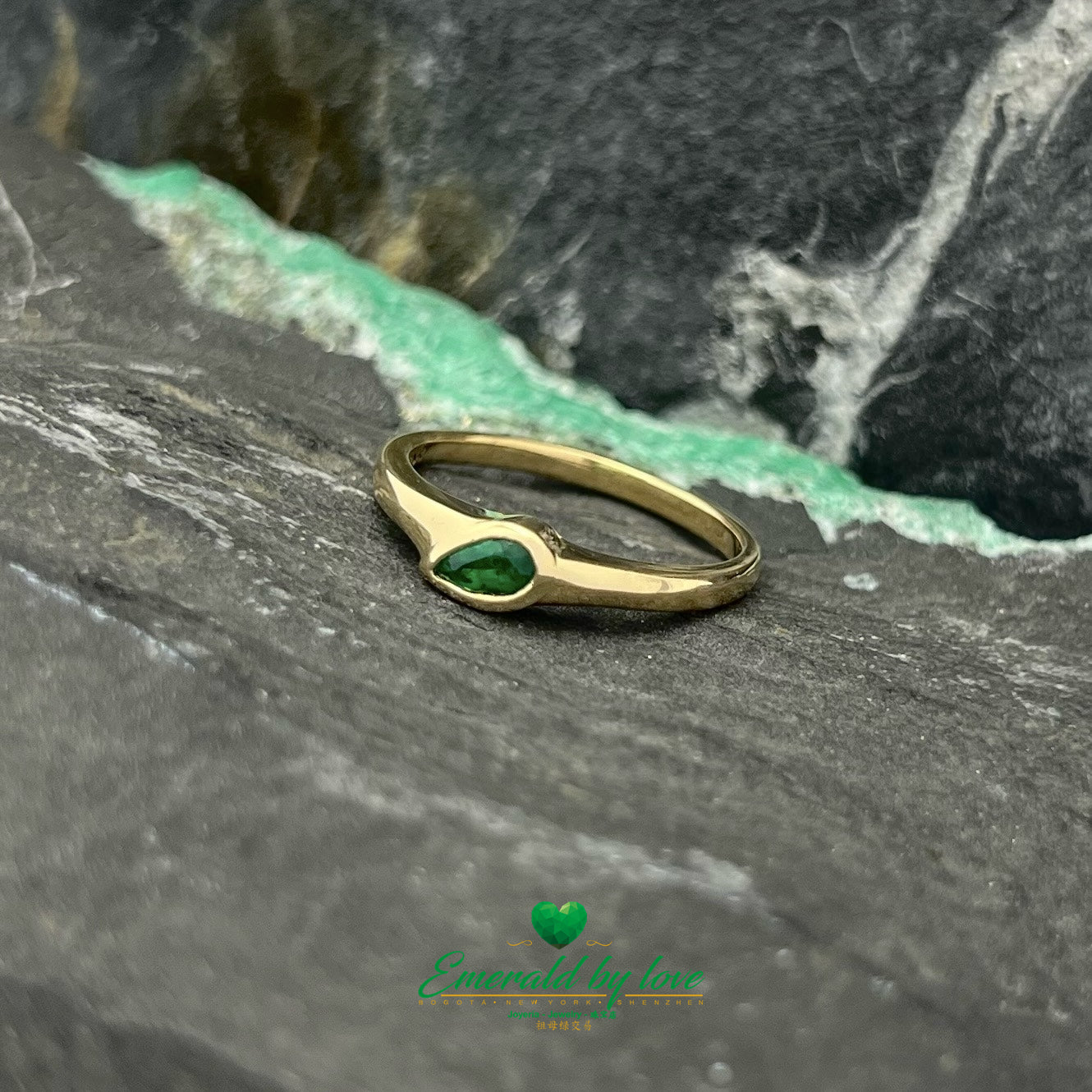 Minimalist Elegance: Sideways Pear-Shaped Emerald Bezel Ring