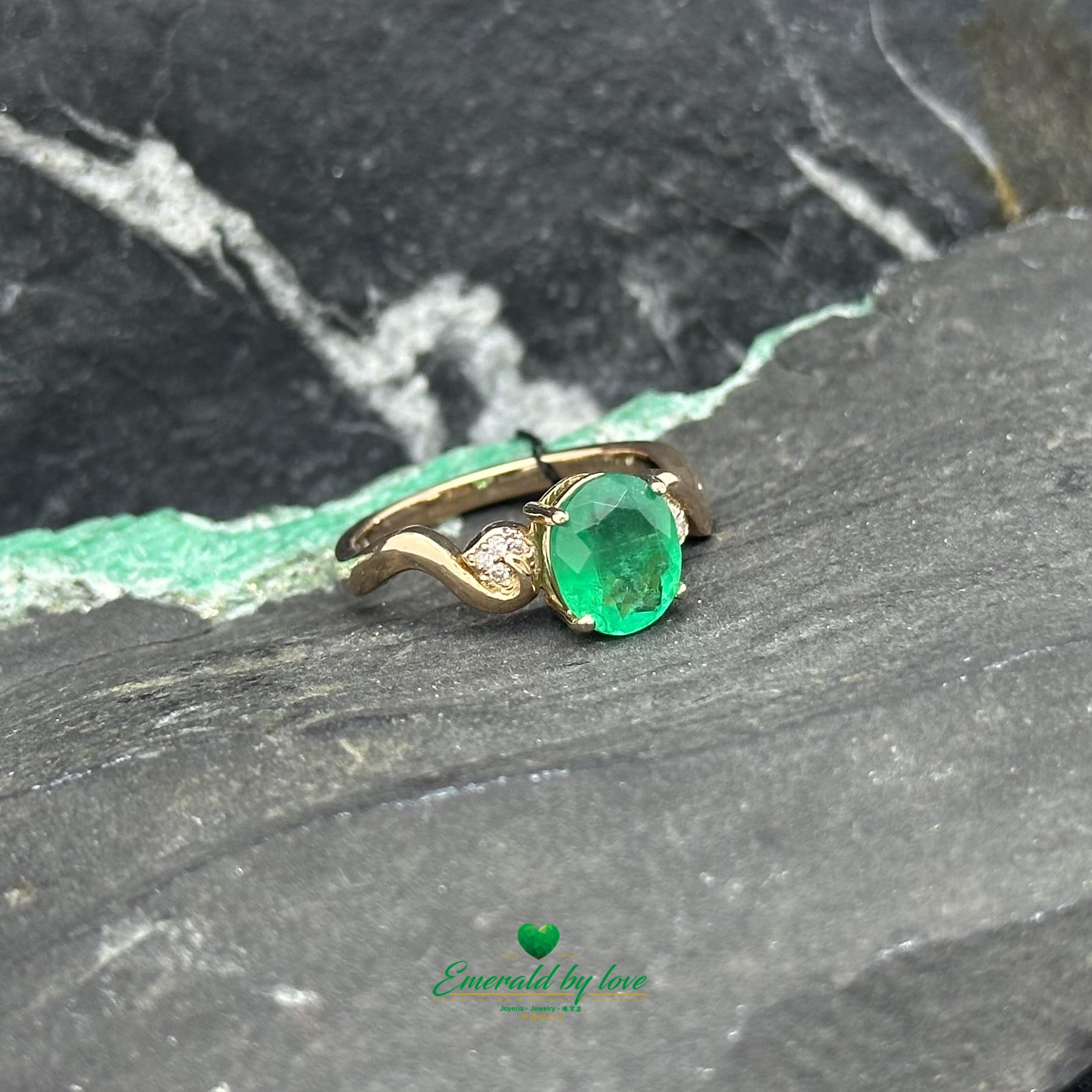 Detailed Rose Gold Ring with Central Oval Emerald and Diamond-Accented Filigree