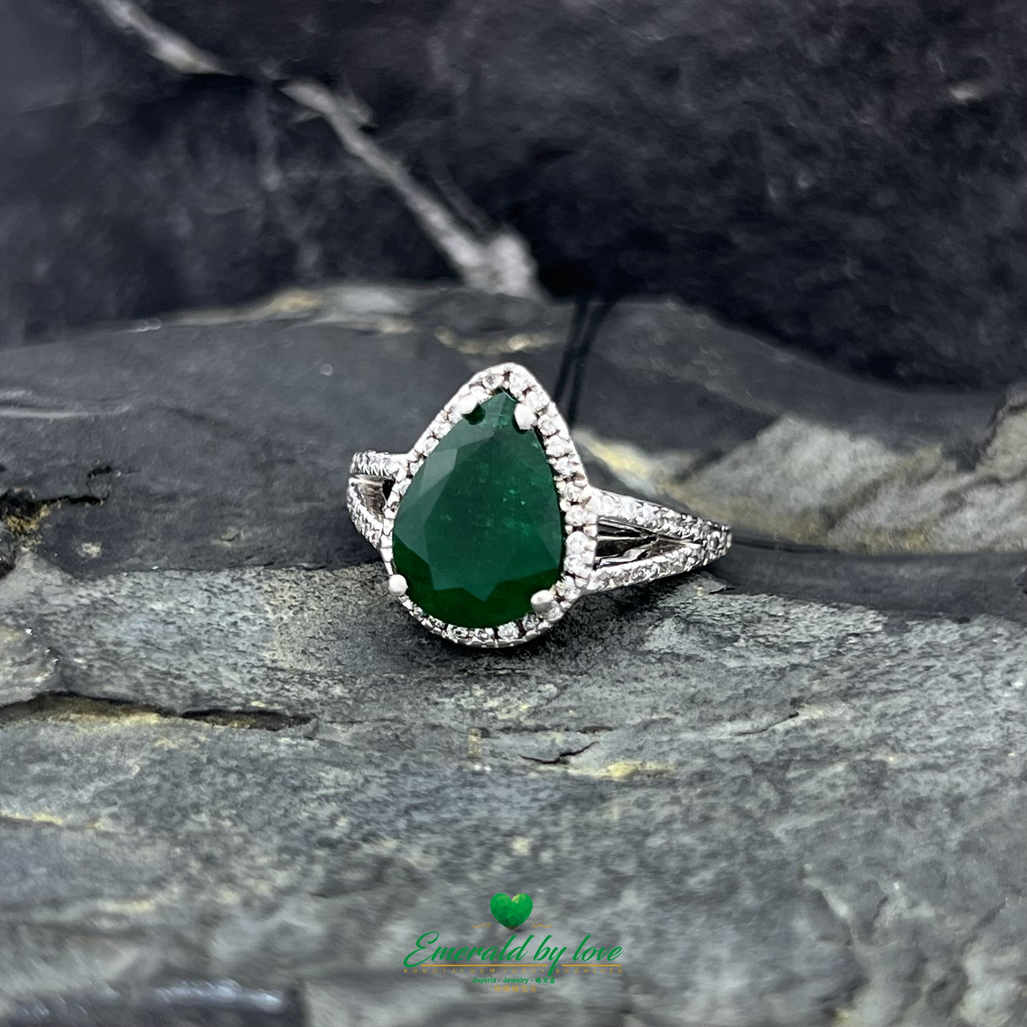 White Gold Ring with Dark Green Emerald Surrounded by Diamonds