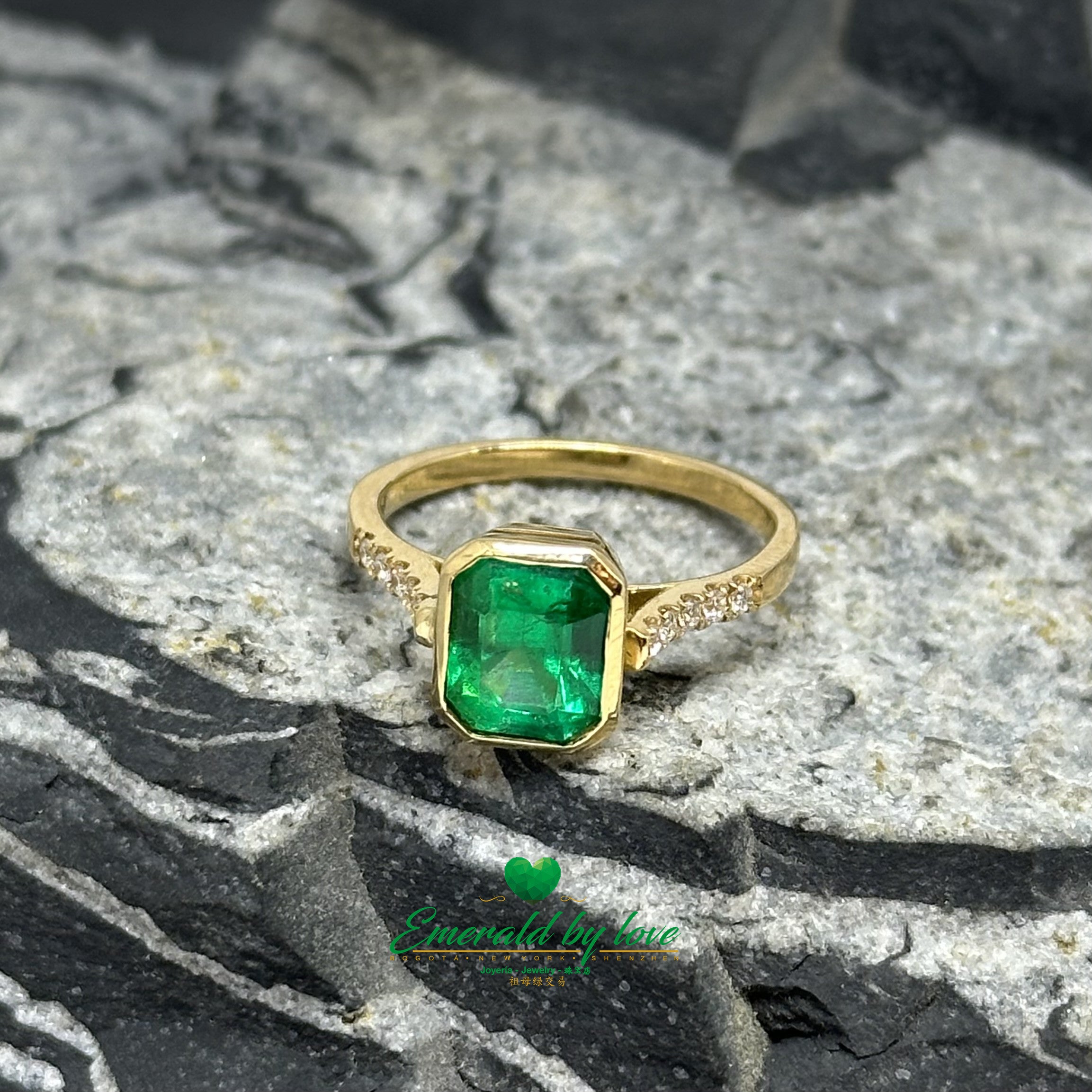 Elegant Bezel-Set Emerald-Cut Emerald Engagement Ring with Diamond Band