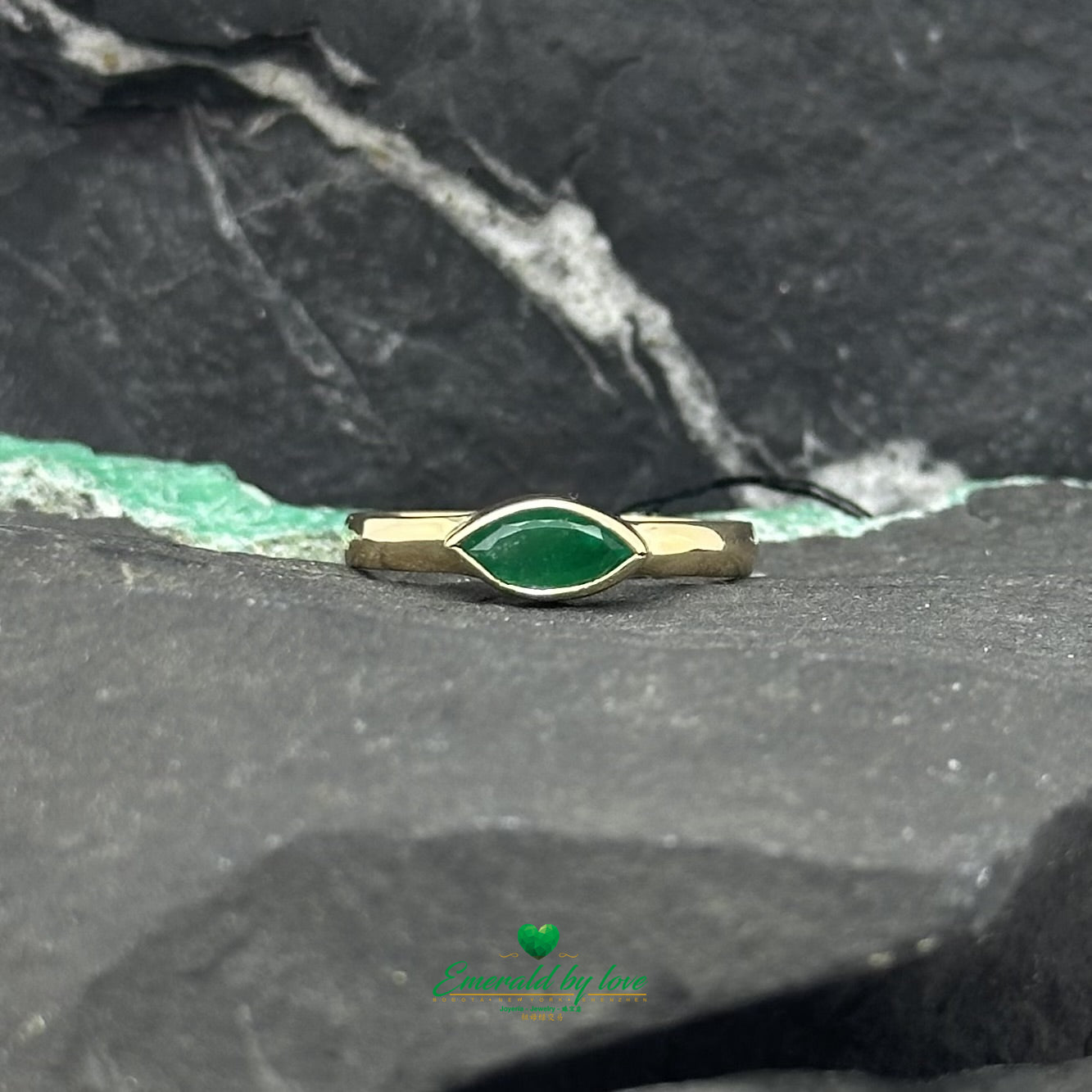 Elegant Solitaire Ring with Bezel-Set Marquise Colombian Emerald