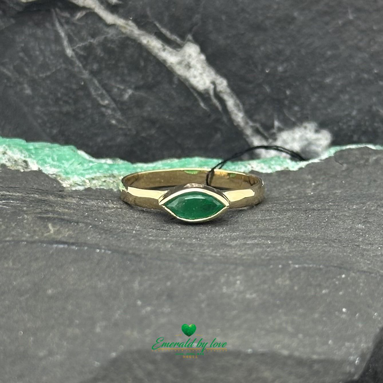 Elegant Solitaire Ring with Bezel-Set Marquise Colombian Emerald