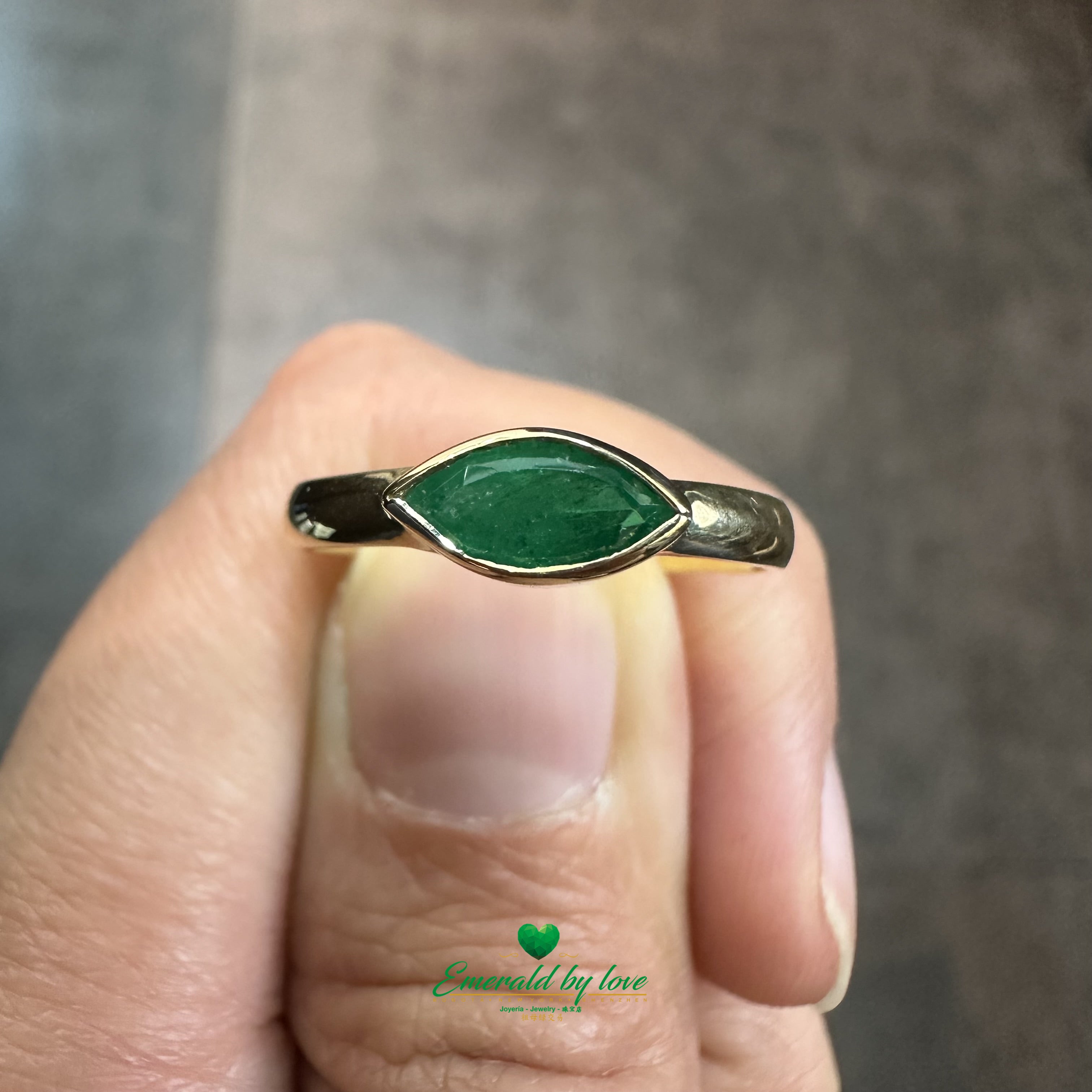 Elegant Solitaire Ring with Bezel-Set Marquise Colombian Emerald