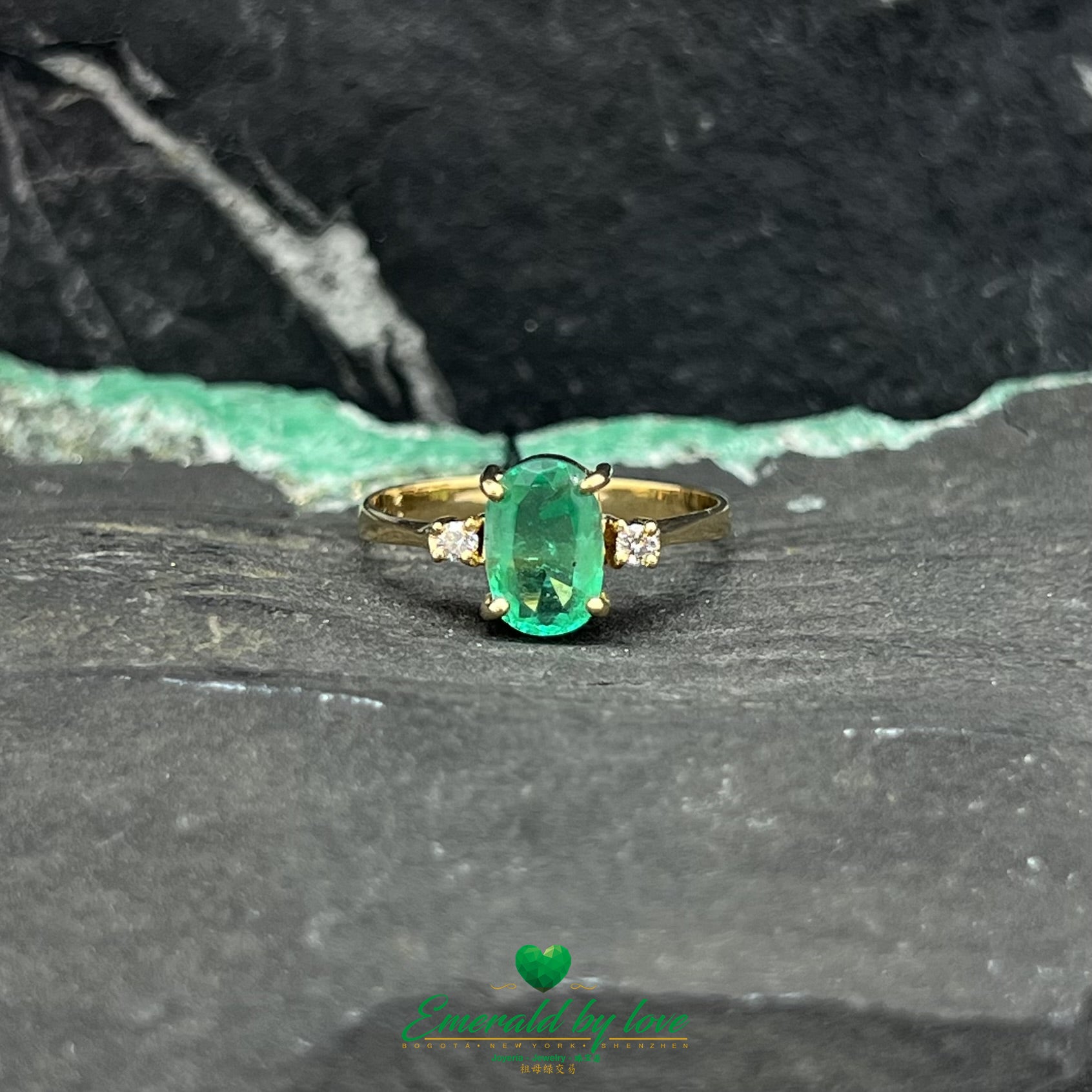 Refined ring with Oval Cut Crystal Emerald and Side Diamonds