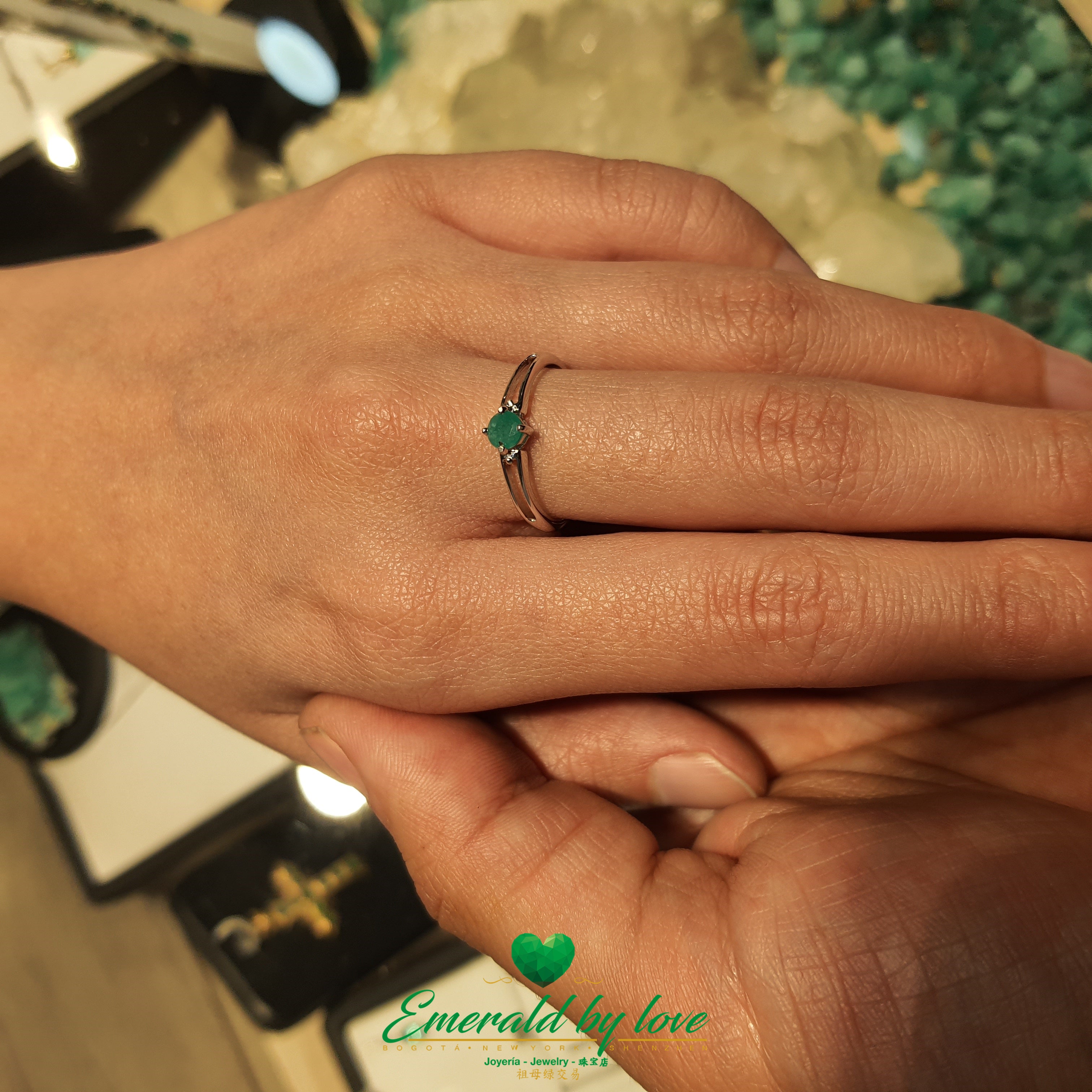 Solitaire Ring with Round Central Emerald and Openwork Band
