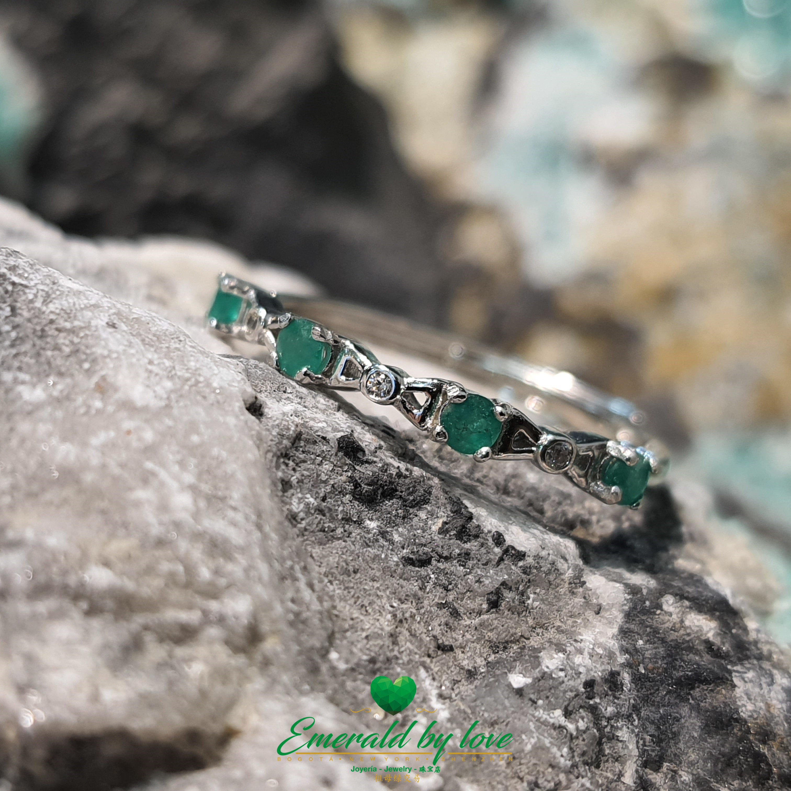 Minimalist Band Ring with Tiny Round Emeralds Connected by Triangular Bow Details