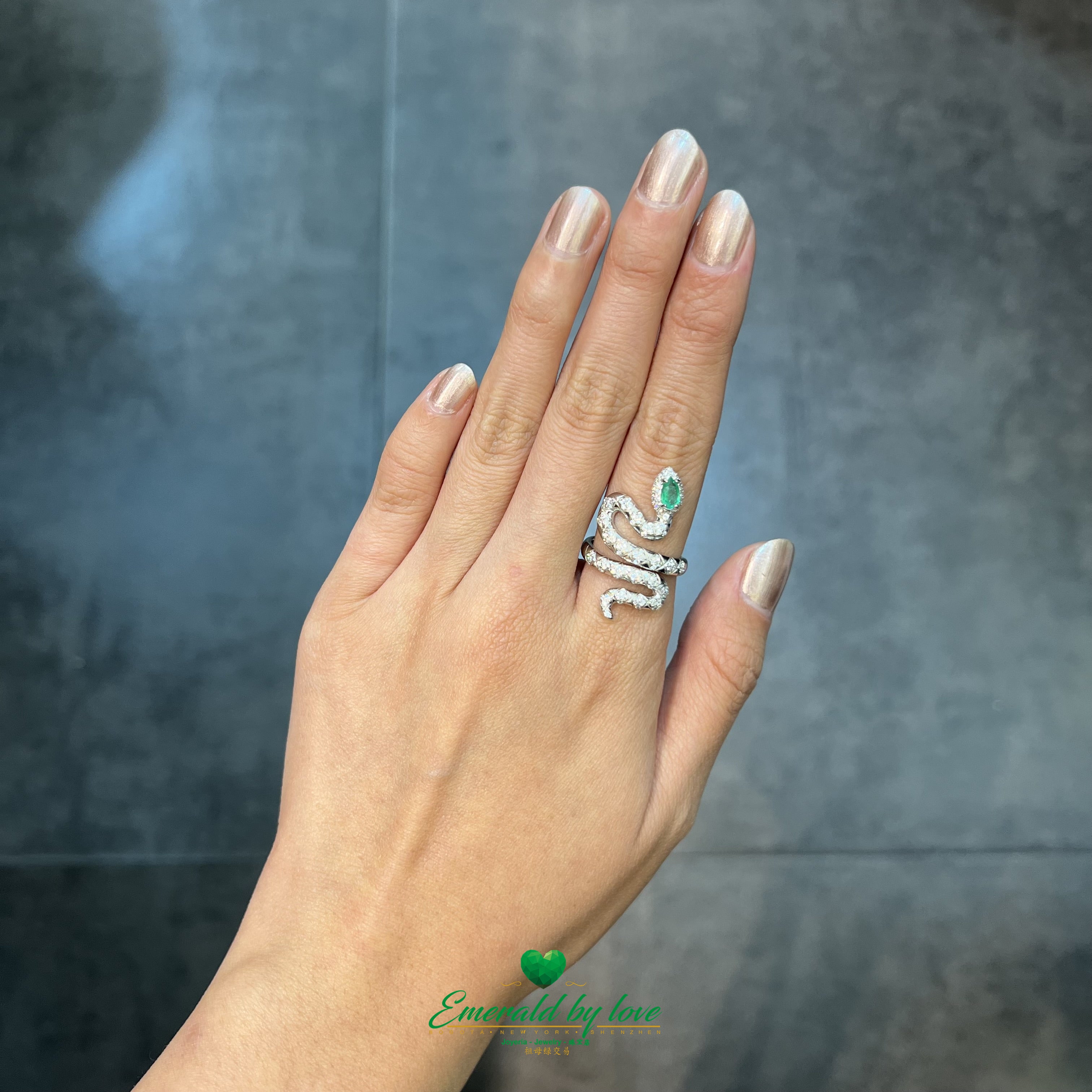 Silver Snake Ring with White Zircons and Pear-Shaped Emerald Head