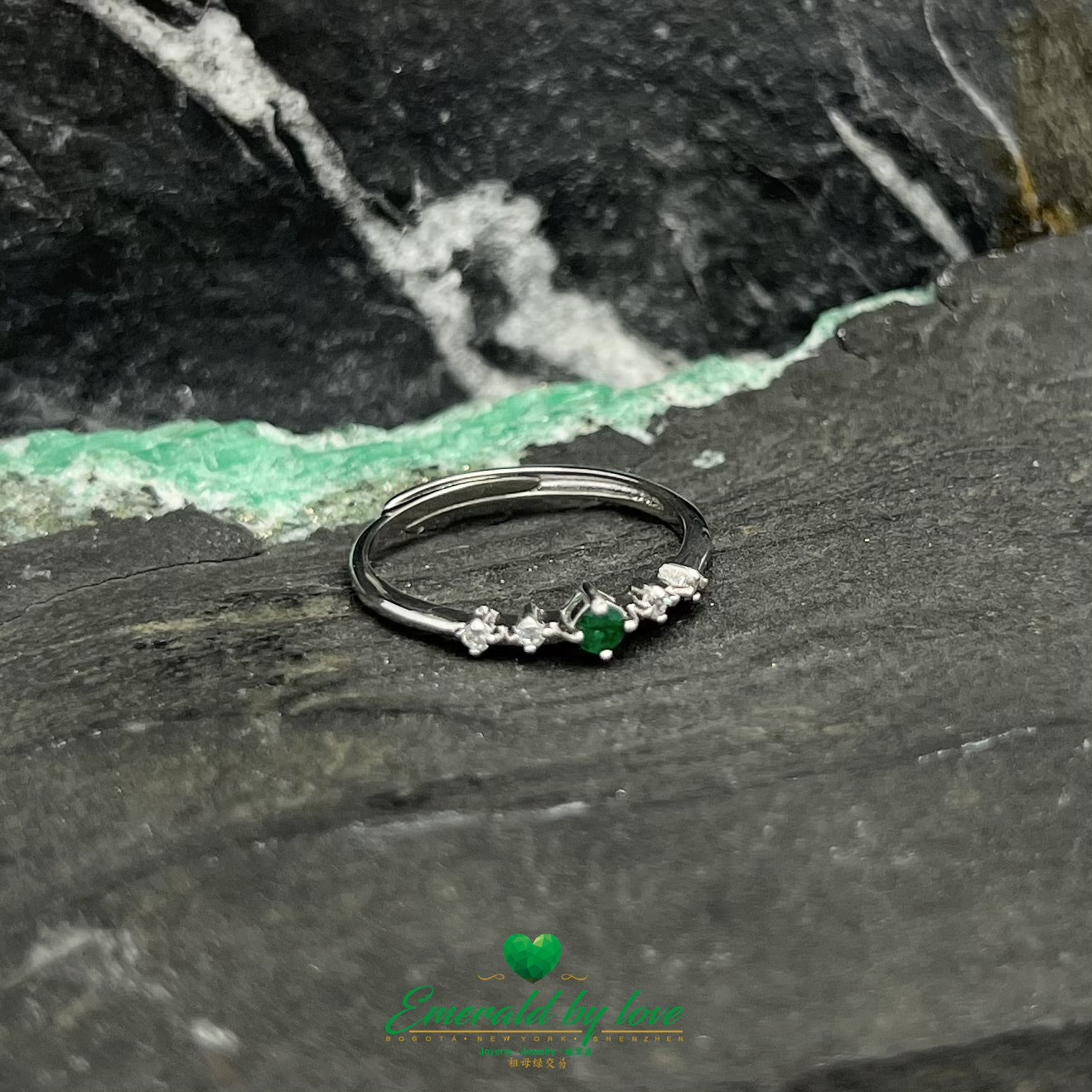 Thin Ring with Petite Central Emerald and Side Zircons
