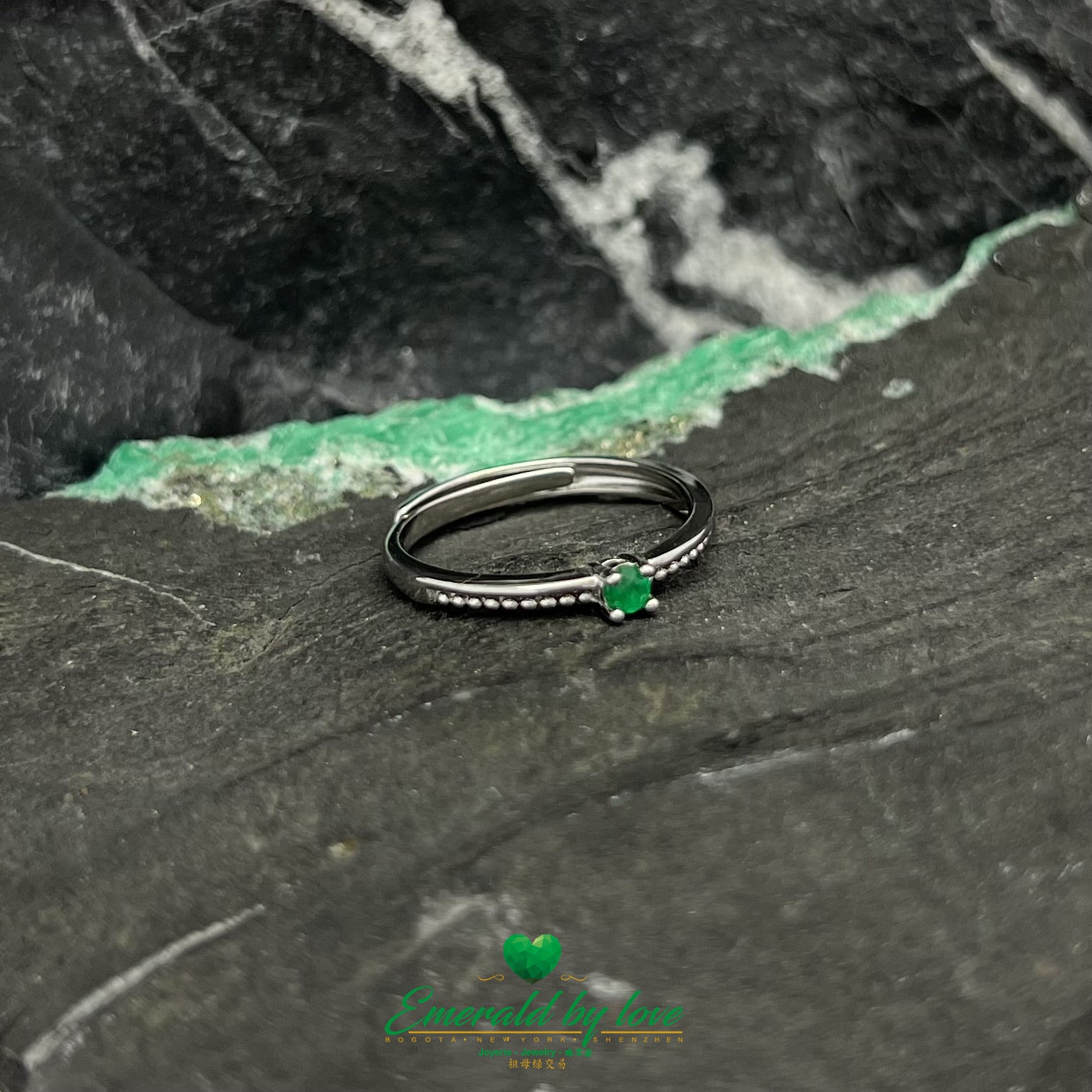 Sterling Silver Ring with Circular Details and Central Emerald Stone