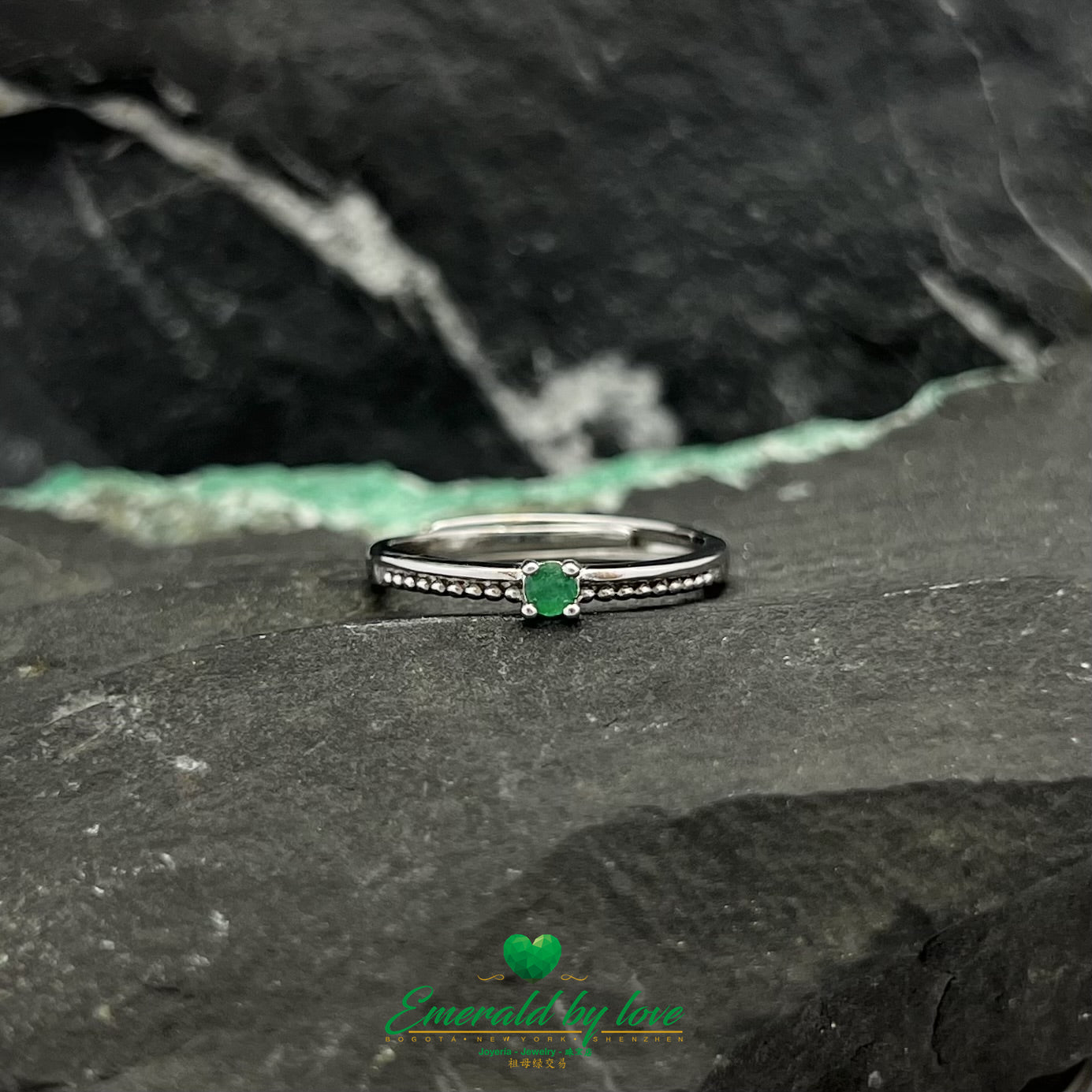Sterling Silver Ring with Circular Details and Central Emerald Stone
