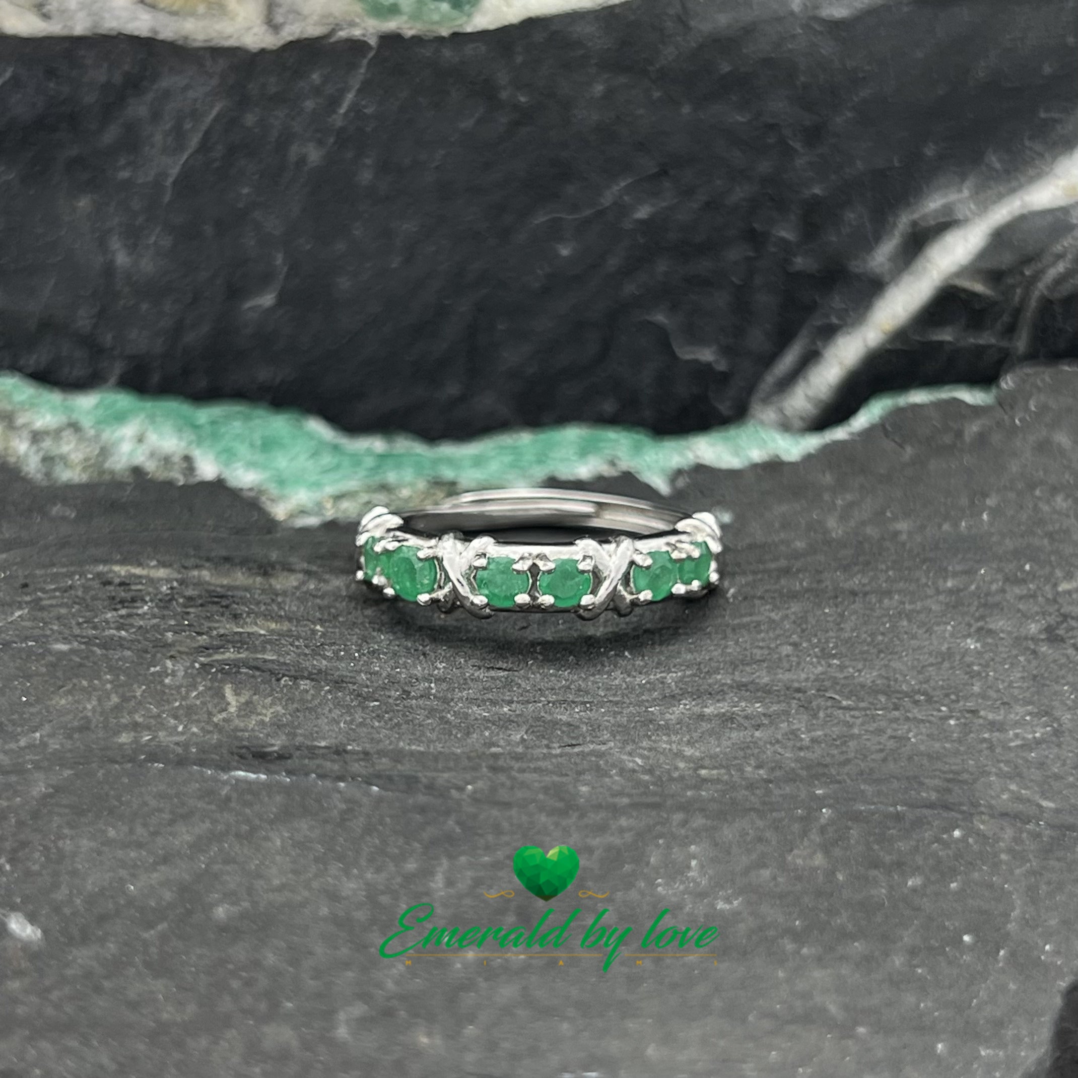 Elegant Band Ring with Six Round Emeralds in Pairs