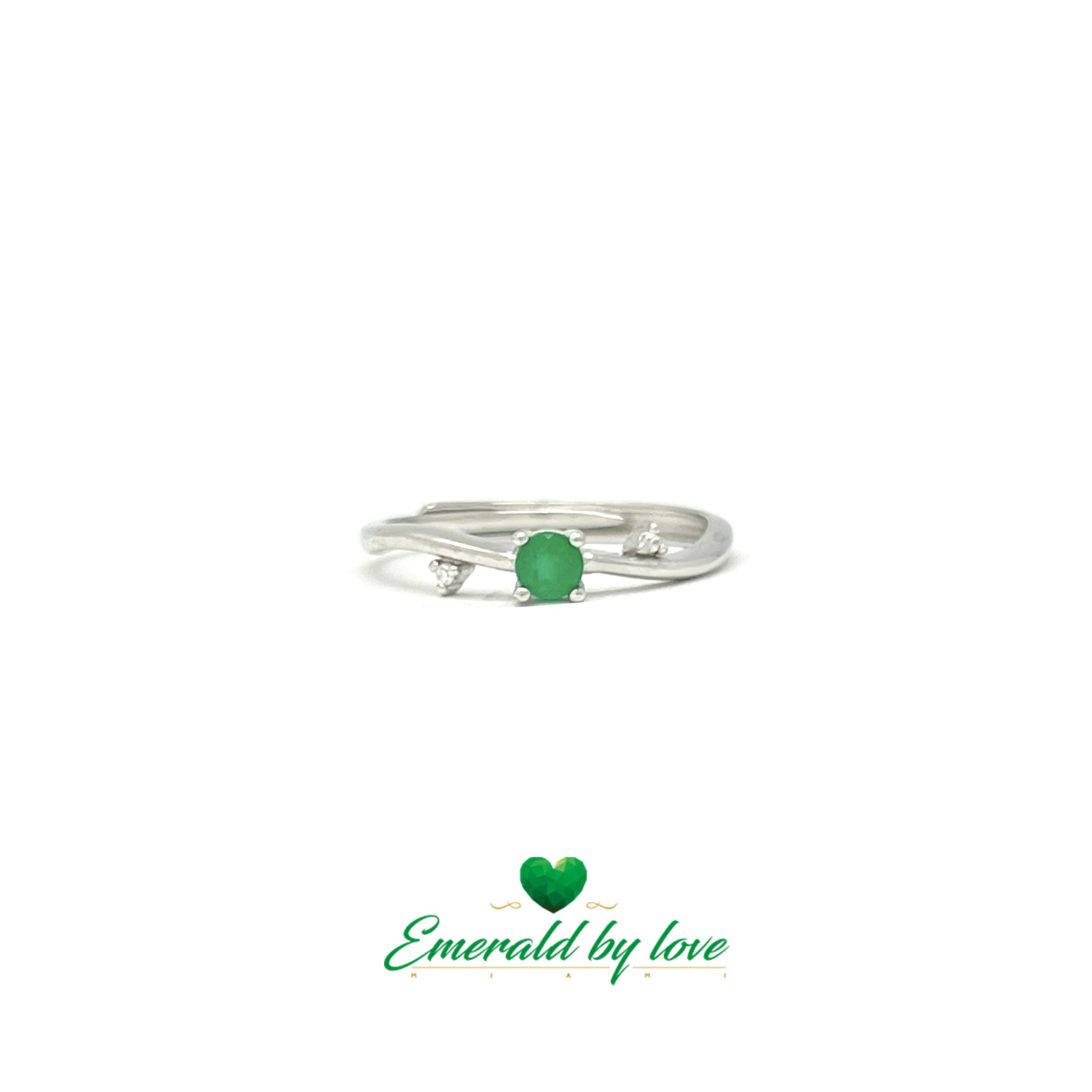 Delicate Ring with Central Round Emerald and Side Zircon Accents