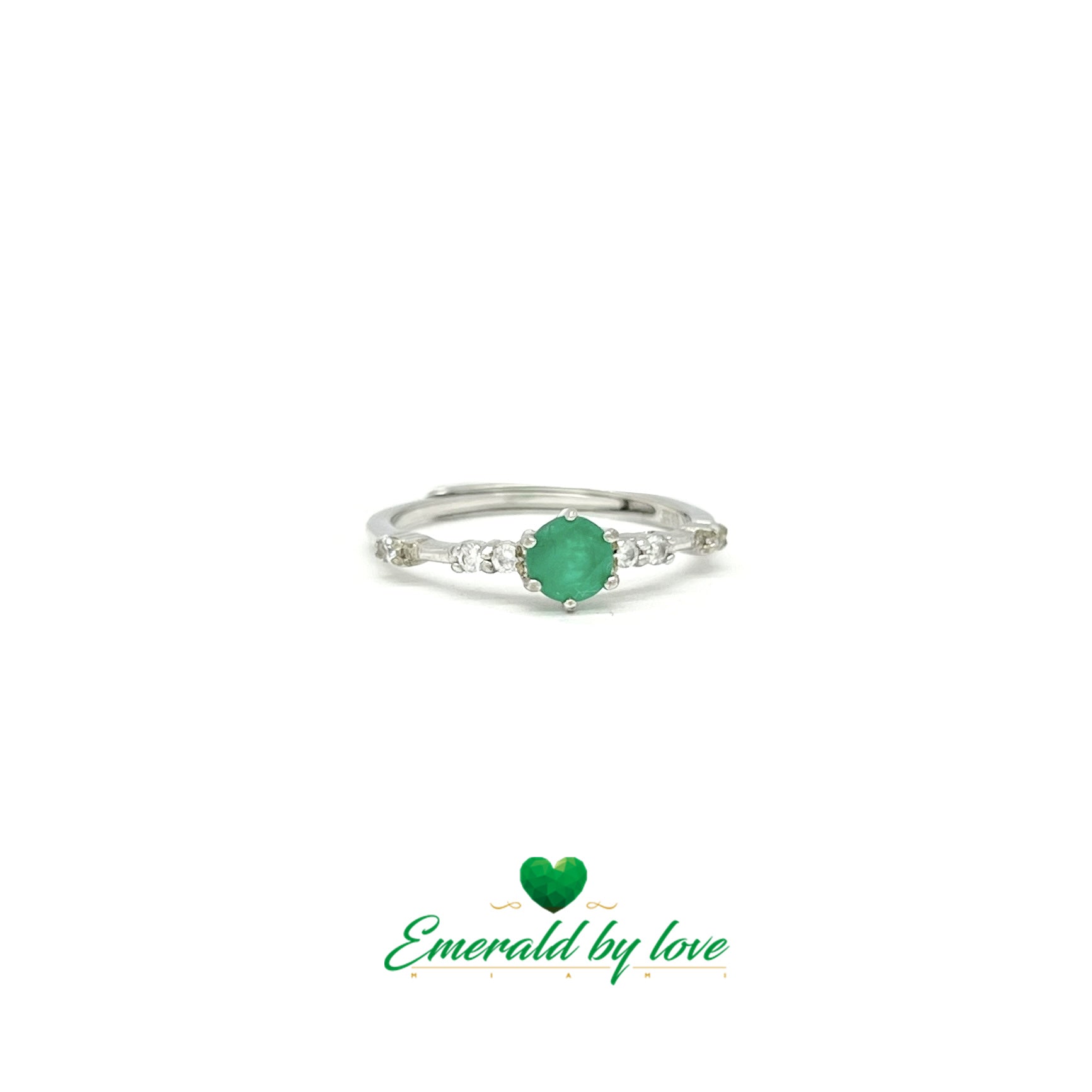 Fine Ring with Delicate Band Decorated with Zircons and Central Round Emerald