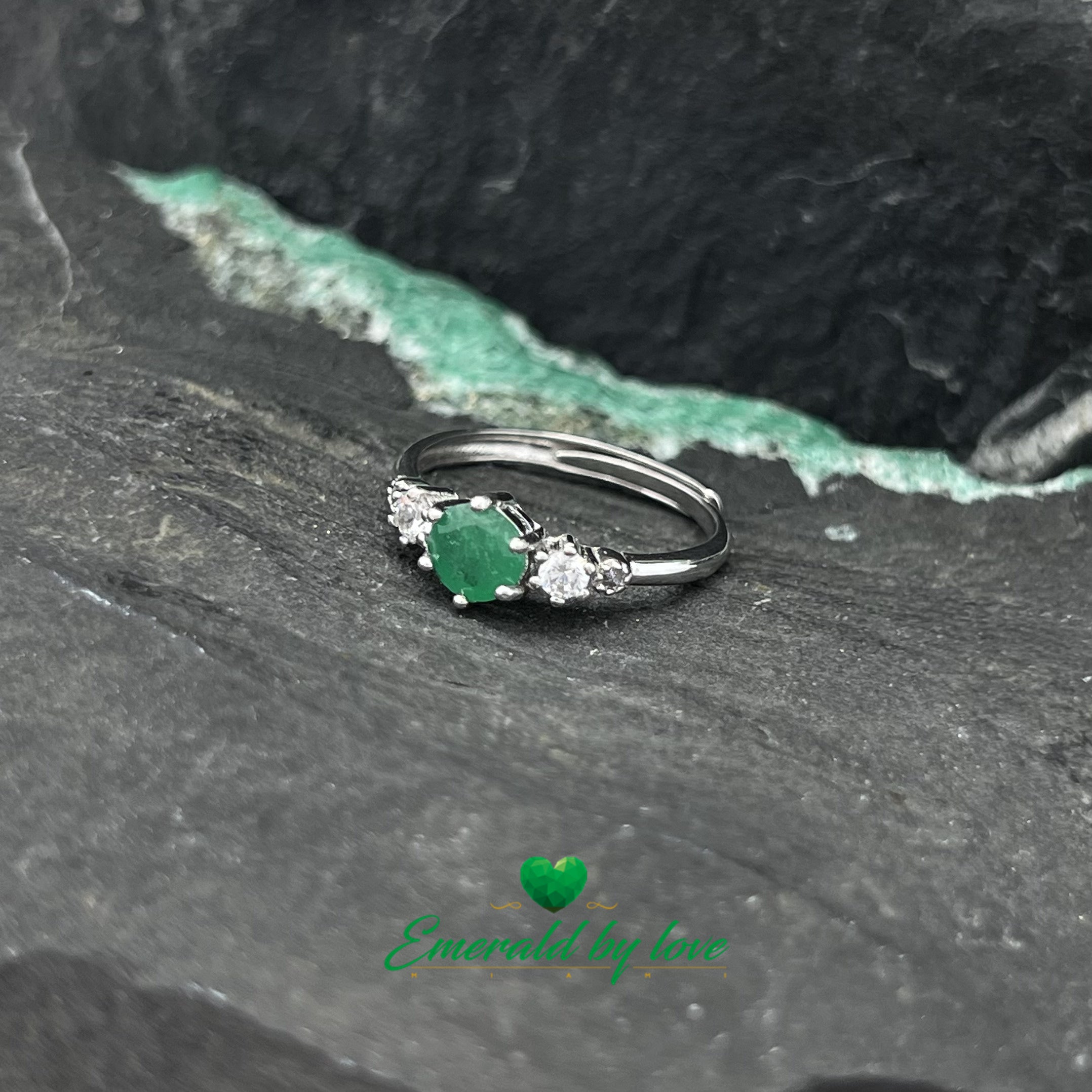 Classy Ring with 0.42ct Central Round Emerald and Matching Side Zircons