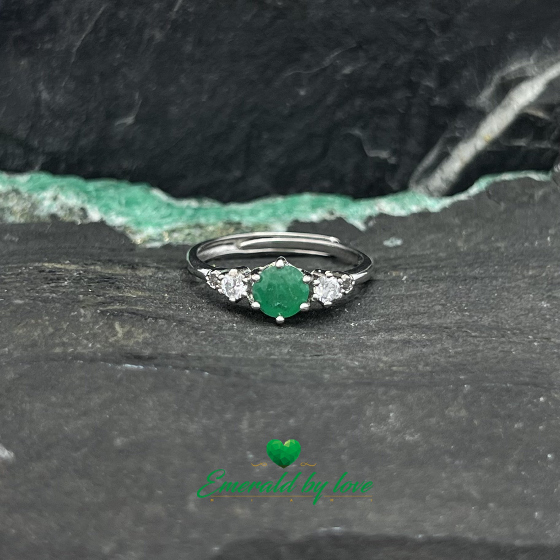 Classy Ring with 0.42ct Central Round Emerald and Matching Side Zircons