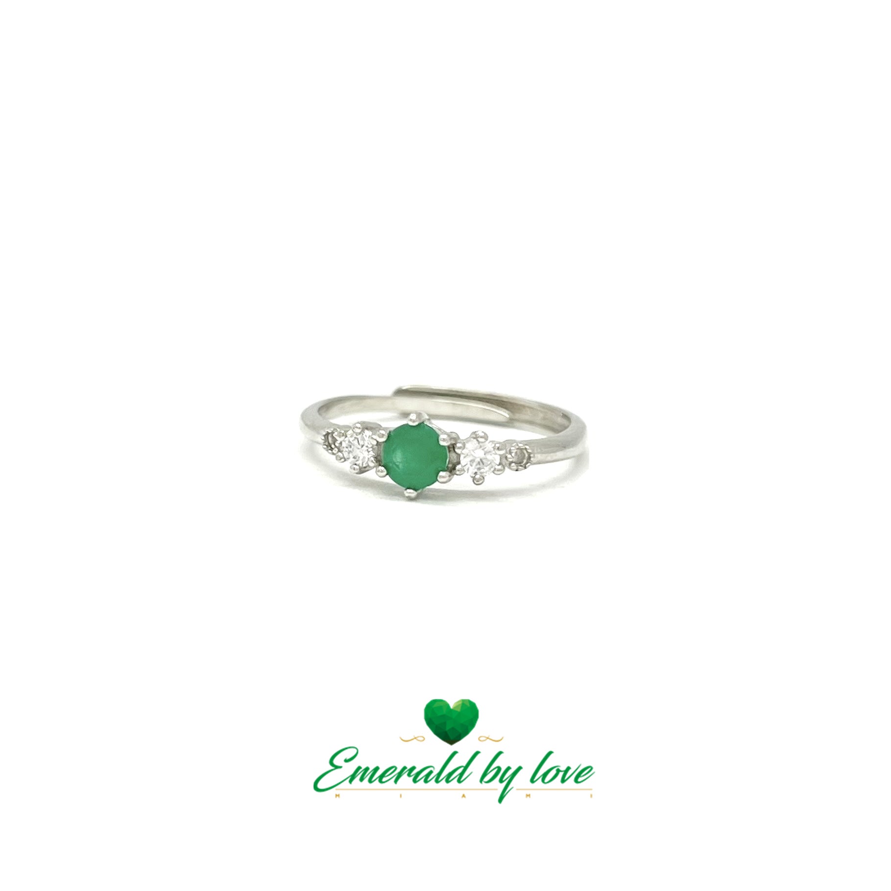 Elegant Thin Ring with Central Round Emerald of 0,25 ct and Matching Side Zircons