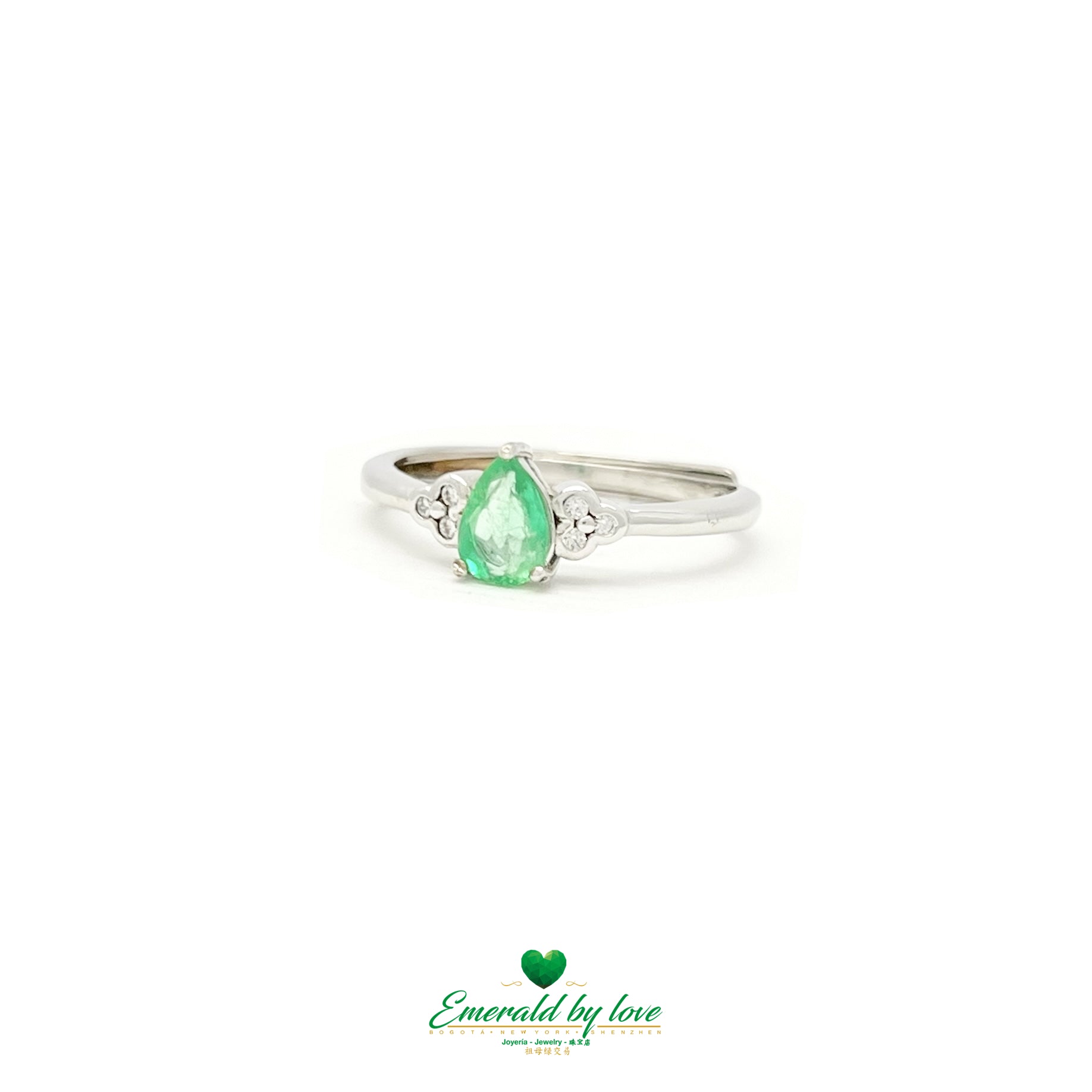 Ring with Central Teardrop Emerald and Zircon Flower Accents